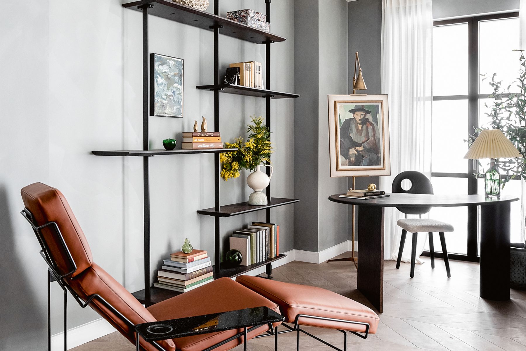 The serene study features the Magis Traffic chaise longue by Konstantin Grcic, Cattelan Italia bookshelf, and a Kidney desk and Pebble chair from Fred Rigby Studio
