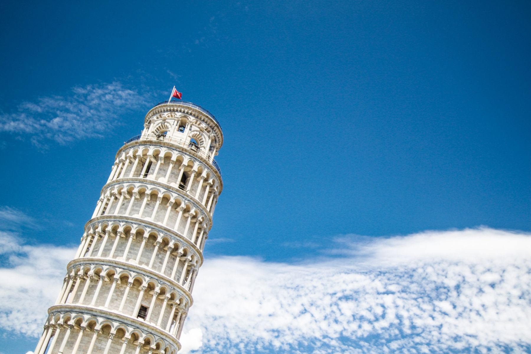 One does not leave Italy without taking a photo with the famous Torre Pendente di Pisa (Leaning Tower of Pisa). After many worked to straighten the tower, engineers expect it to stand tall and tower over enthralled tourists for 200 more years. | Photo by Palo Cech from Pexels