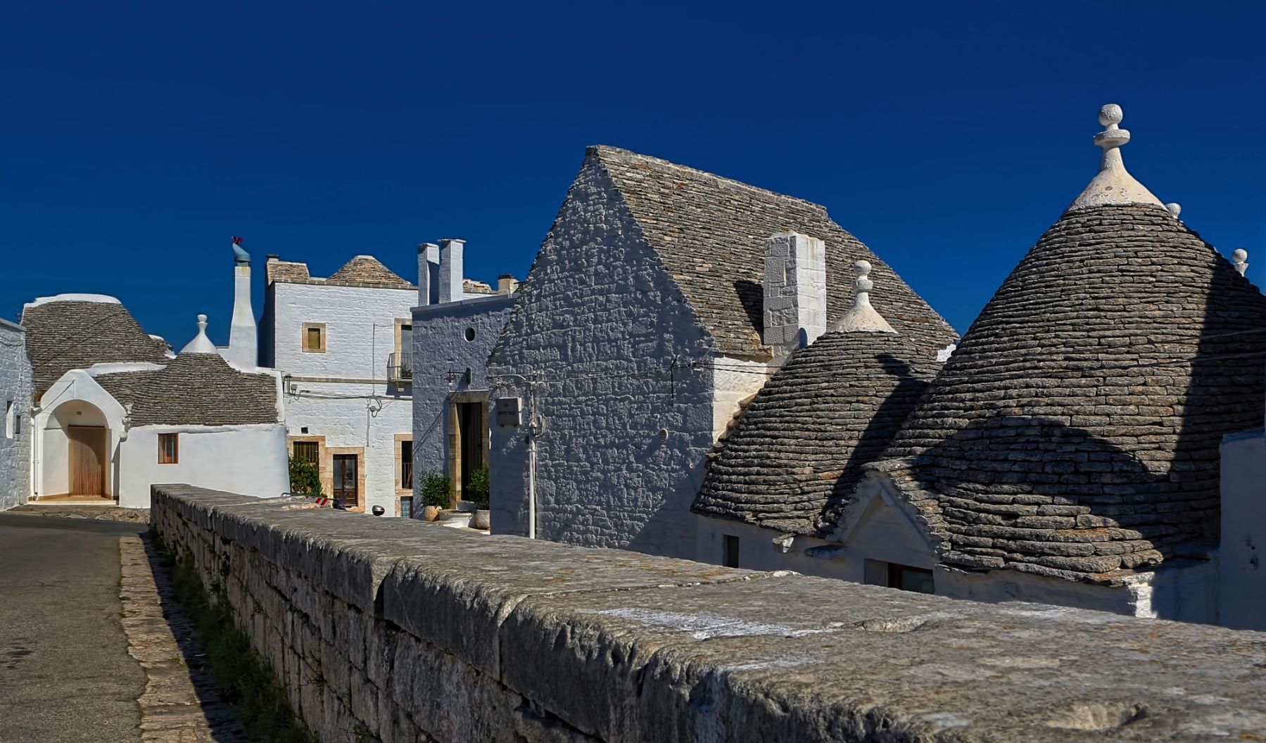 The trulli in Alberobello are buildings constructed with corbelled dry-stone which is a prehistoric building technique that’s still currently used in this part of Italy. The trulli were made as temporary field shelters, storehouses and homes for agricultural labourers or landowners. This UNESCO Heritage Site dates back as early as mid-14th century. | Photo by Ricardo Gomez Angel on Unsplash