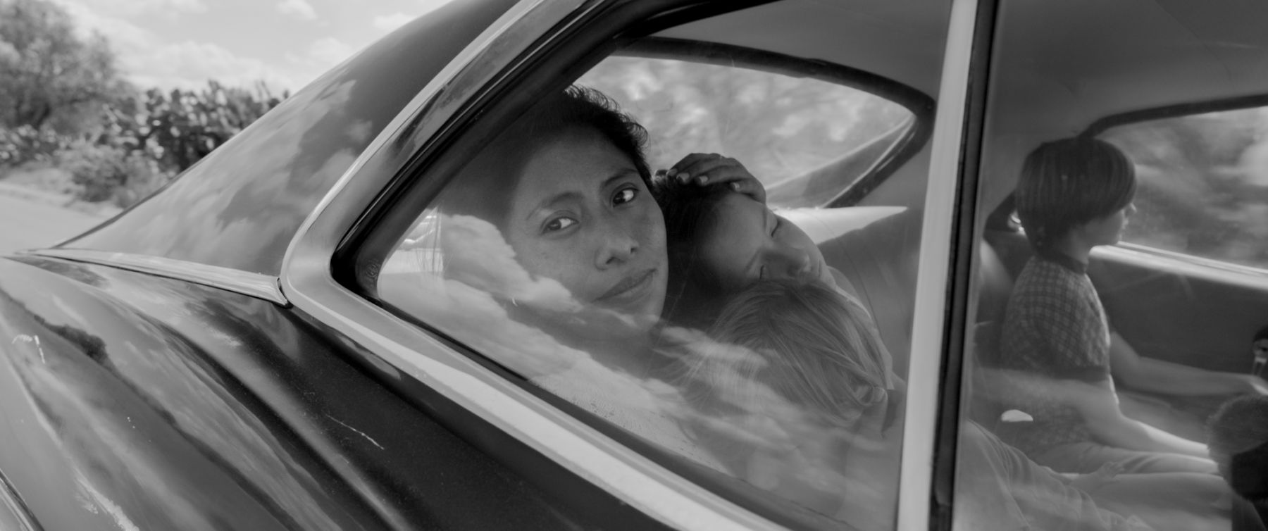 Yalitza Aparicio as Cleo, Marco Graf as Pepe, Carlos Peralta Jacobson as Paco, and Daniela Demesa as Sofi in Roma, written and directed by Alfonso Cuaron. | Image by Alfonso Cuaron / Courtesy of Netflix