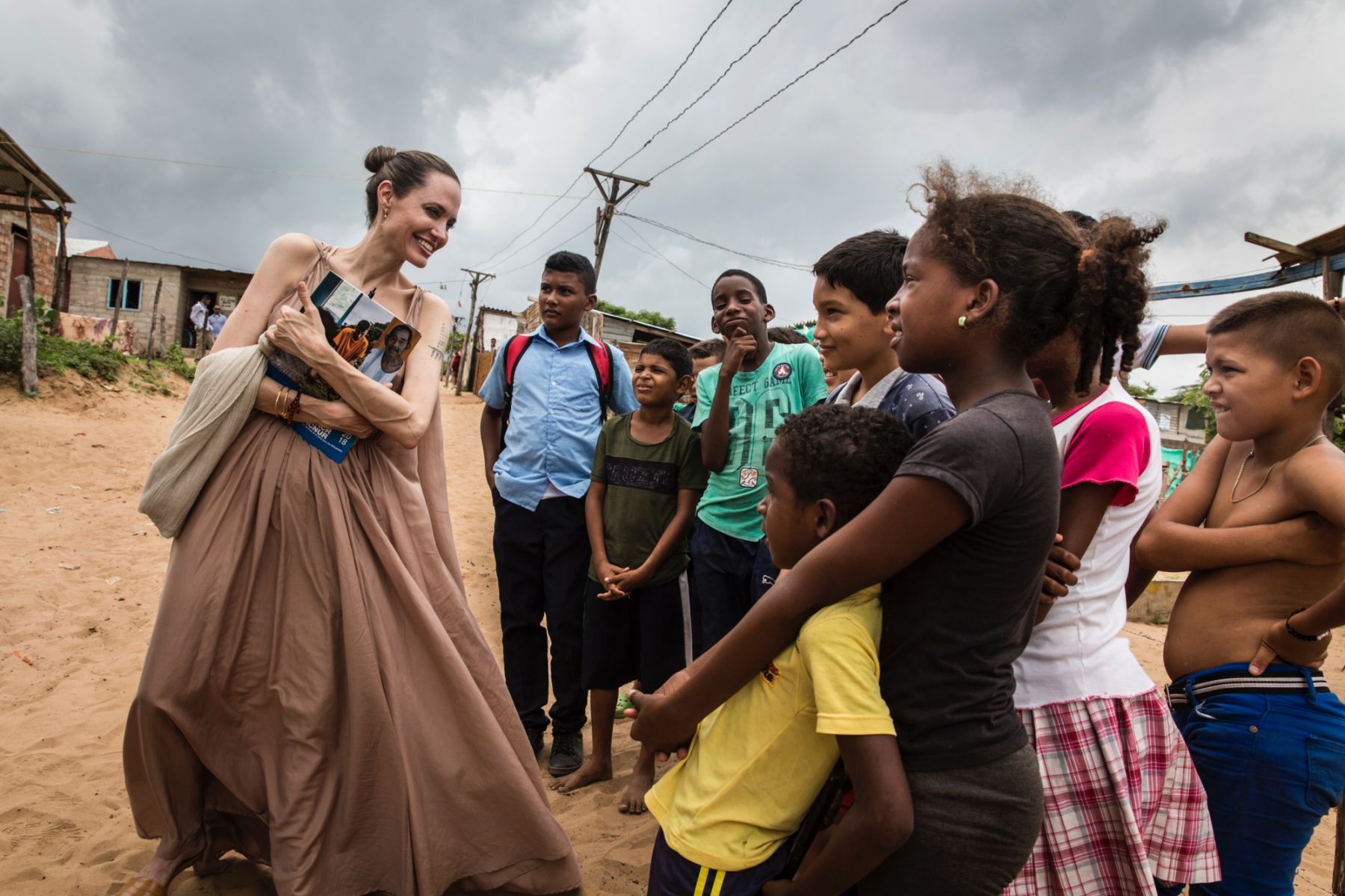 UNHCR Special Envoy Angelina Jolie speaks with children who fled Venezuela, in Brisas del Norte, an informal settlement in Riohacha, Colombia, on June 7, 2019. The informal settlement is inhabited by Colombian refugees who have returned to their country as well as Venezuelans escaping a political and economic crisis back home. Over 4 million Venezuelans are now living in exile, with Colombia taking in the greatest share, even as it seeks to implement a peace deal ending five decades of conflict inside its o