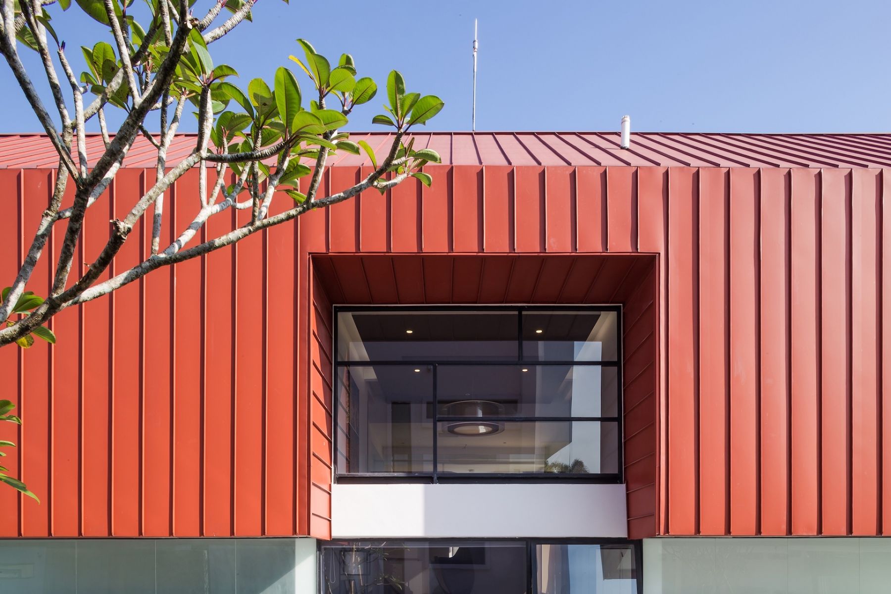 The weathered red of the barn roof evokes a sense of nostalgia