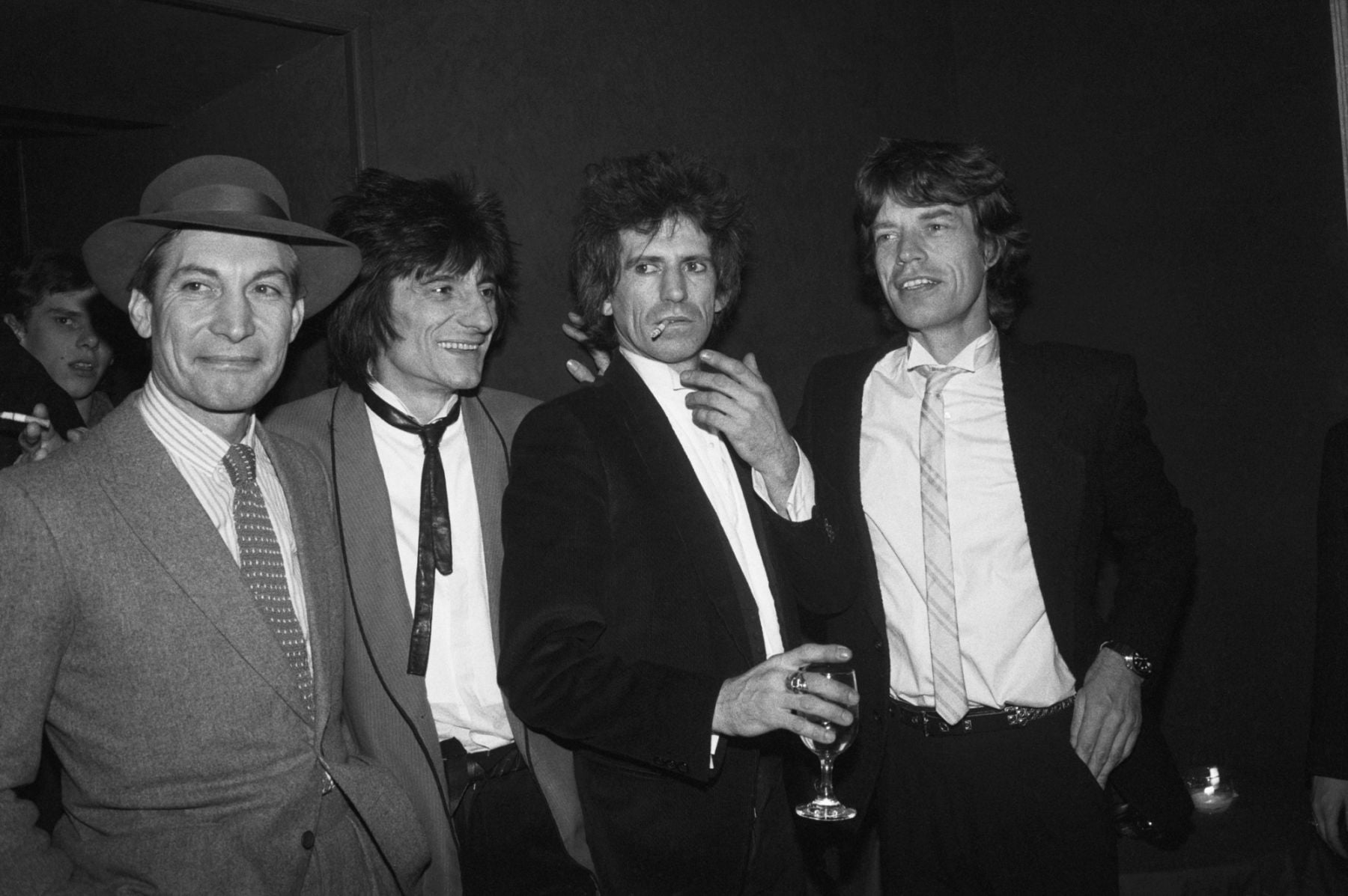 (Original Caption) 1/18/1983-New York, New York-The Rolling Stones get together at a party for the opening of their new movie, "Let's Spend the Night Together." Left to right: Charlie Watts, Ron Wood, Keith Richards and Mick Jagger.