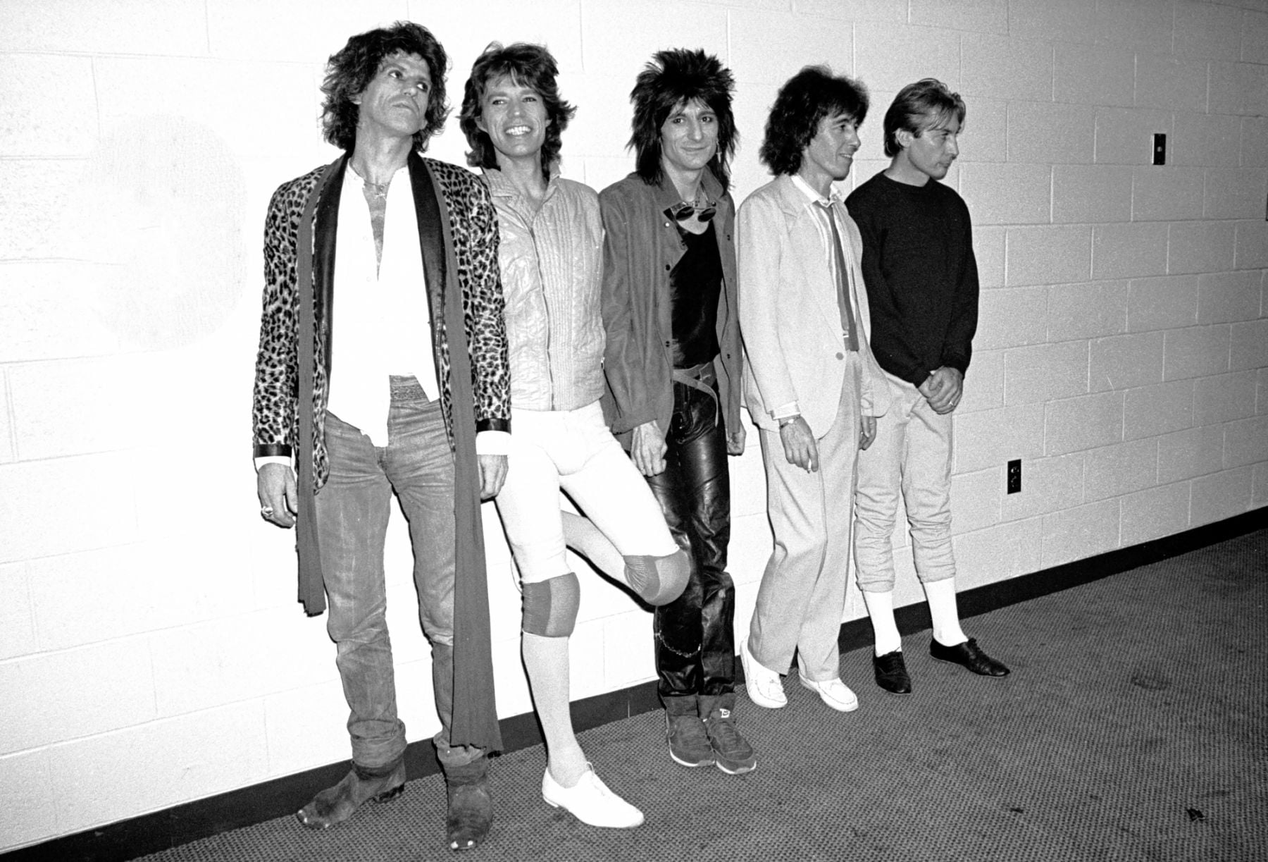 Portrait of the members of British Rock group the Rolling Stones as they pose backstage before their performance at Brendan Byrne Arena (later Meadowlands Arena), East Rutherford, New Jersey, November 5, 1981. Pictured are, from left, Keith Richards, Mick Jagger, Ronnie Wood, Bill Wyman, and Charlie Watts. The concert was part of 'The Rolling Stones American Tour 1981' (in support of their album 'Tattoo You'). (Photo by Gary Gershoff/Getty Images)