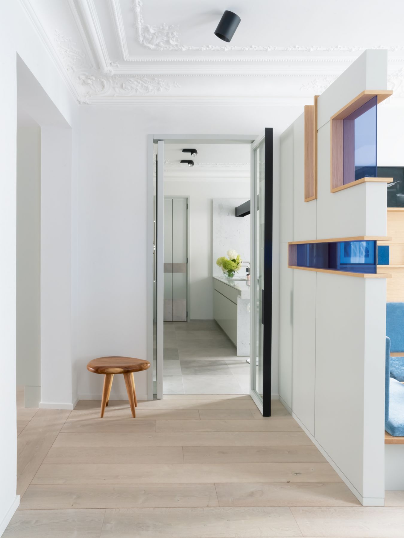 The wooden partitions feature colourful glass inserts that are reminiscent of Dutch painter Piet Mondrian’s work