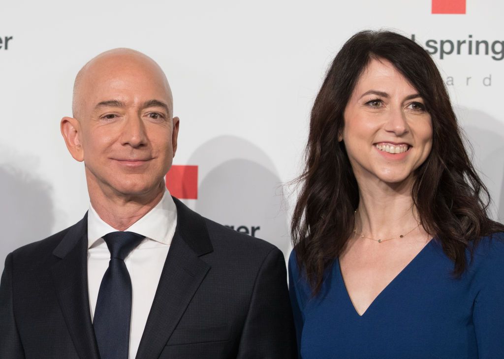 24 April 2018, Germany, Berlin:Â Head of Amazon Jeff Bezos and his wife MacKenzie Bezos arrive for the Axel Springer award ceremony. Bezos will be receiving the award later. Photo: JÃ¶rg Carstensen/dpa (Photo by JÃ¶rg Carstensen/picture alliance via Getty Images)