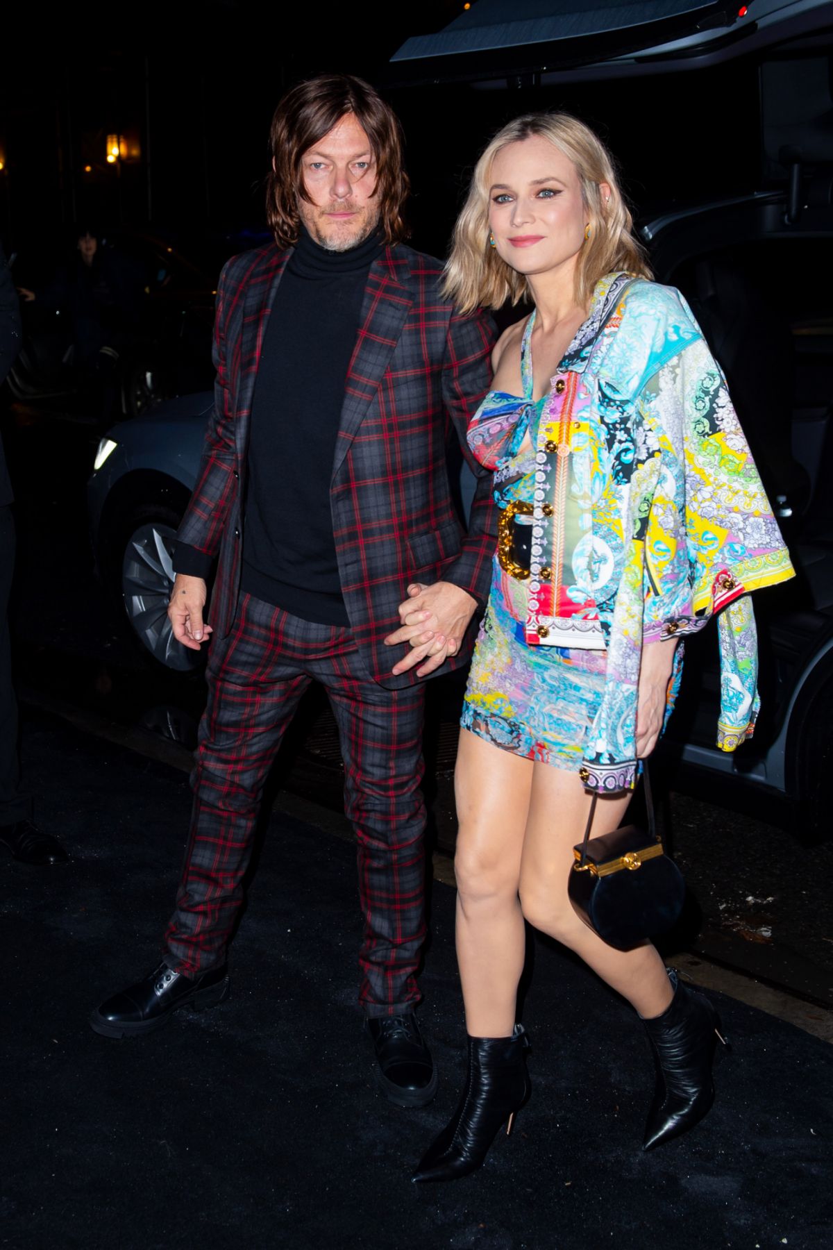 NEW YORK, NEW YORK - DECEMBER 02: Norman Reedus (L) and Diane Kruger attend the Versace Pre-Fall 2019 Runway Show at the American Stock Exchange in the Financial District on December 02, 2018 in New York City. (Photo by Gotham/GC Images)