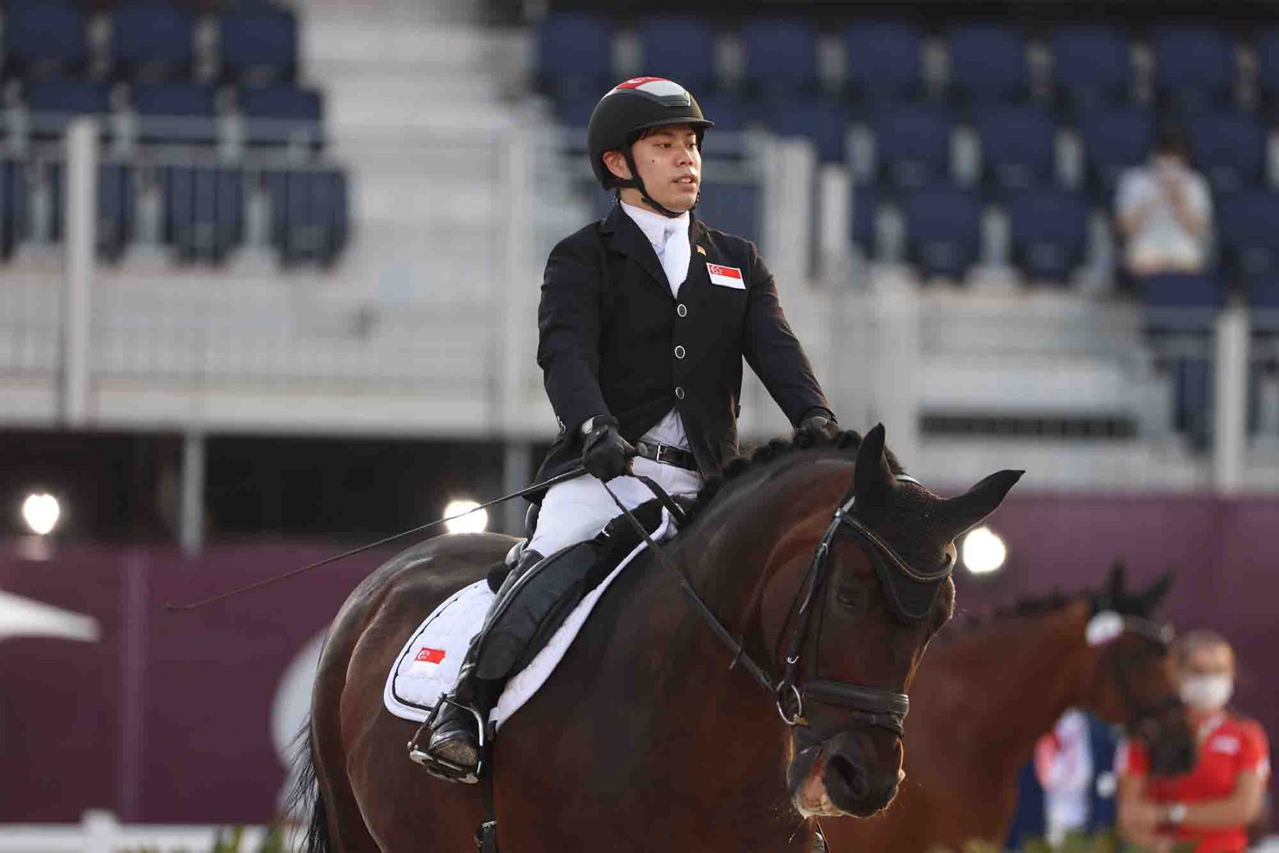 Singapore’s Tan Maximillian rides Don’s Daydream in the dressage individual Test Grade II Equestrian competition. (Photo: AFP and Sport Singapore)