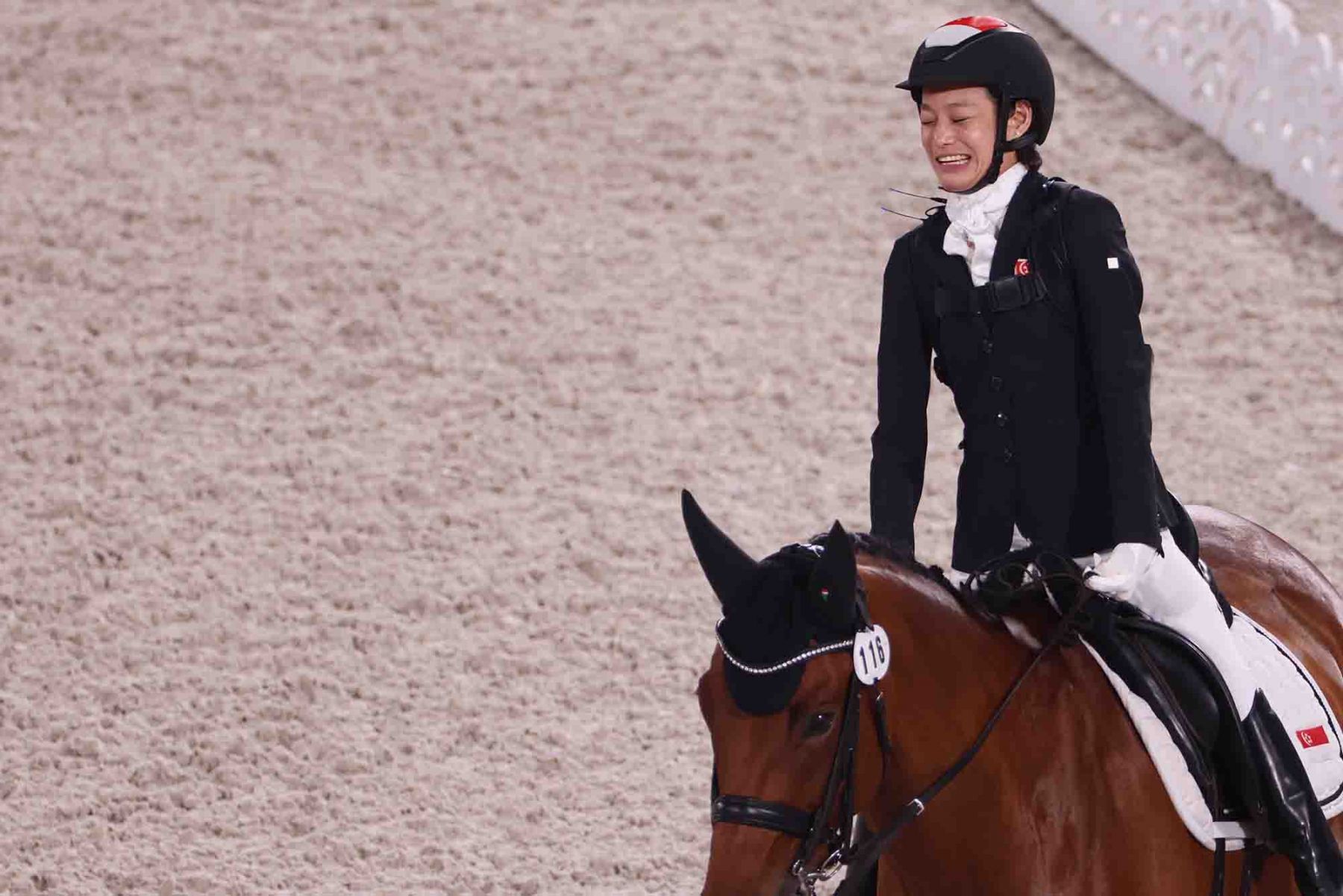 Singapore’s Tan Laurentia reacts as competes rides Banestro in the dressage individual freestyle test Grade I Equestrian competition. (Photo: AFP and Sport Singapore)