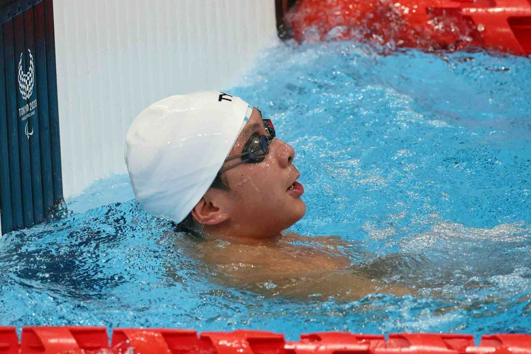 Singapore's Toh Wei Soong competes in the men's 50m freestyle swimming event. (Photo: AFP and Sport Singapore)