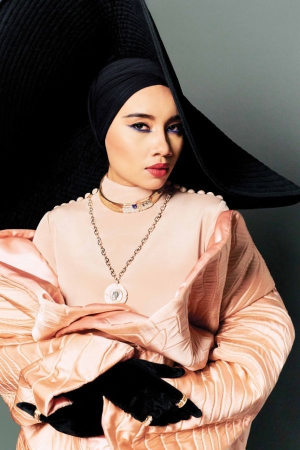 Yuna wears outfit by Innai Red and jewellery by Bulgari