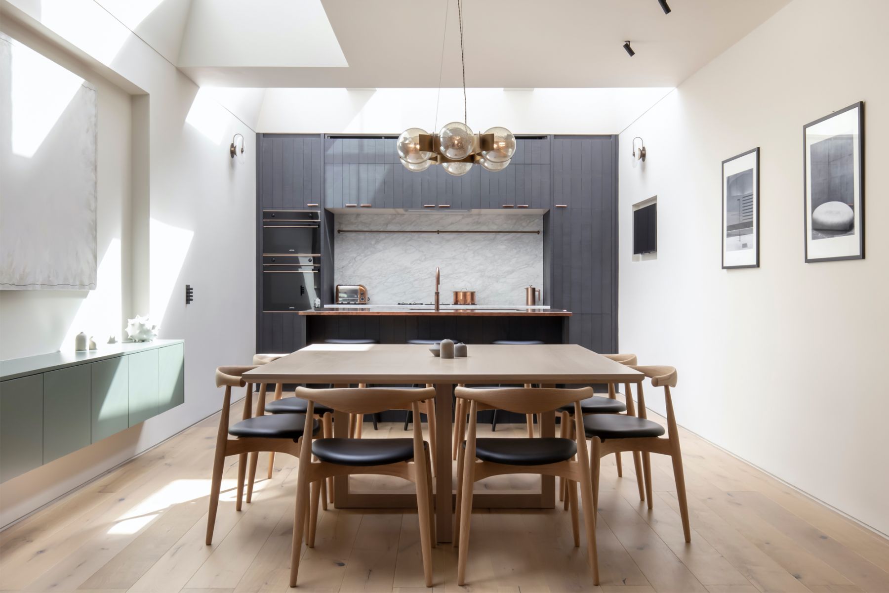 The open-plan kitchen and dining area sits on a former courtyard