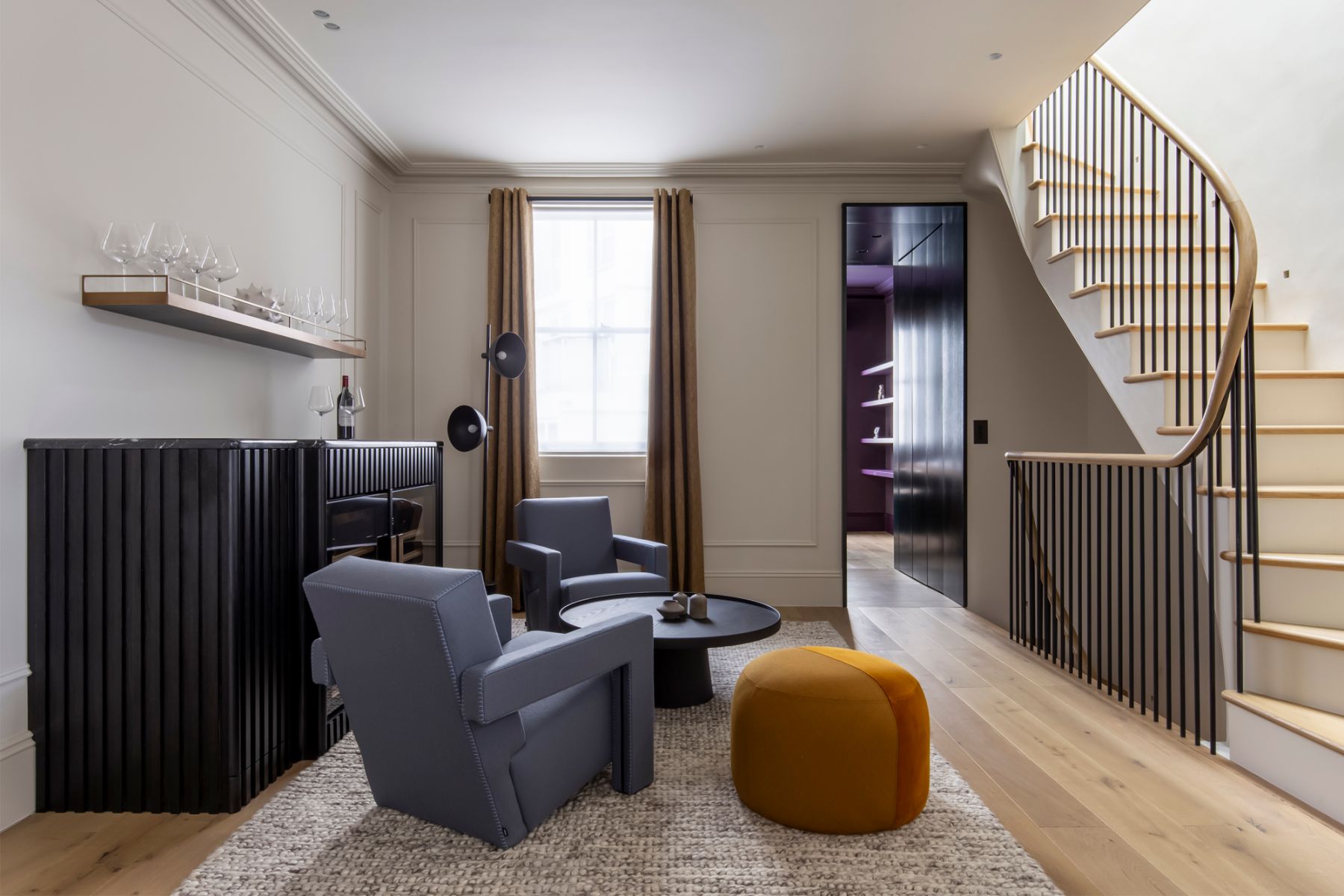 An alternate entertaining space is formed beside the bar