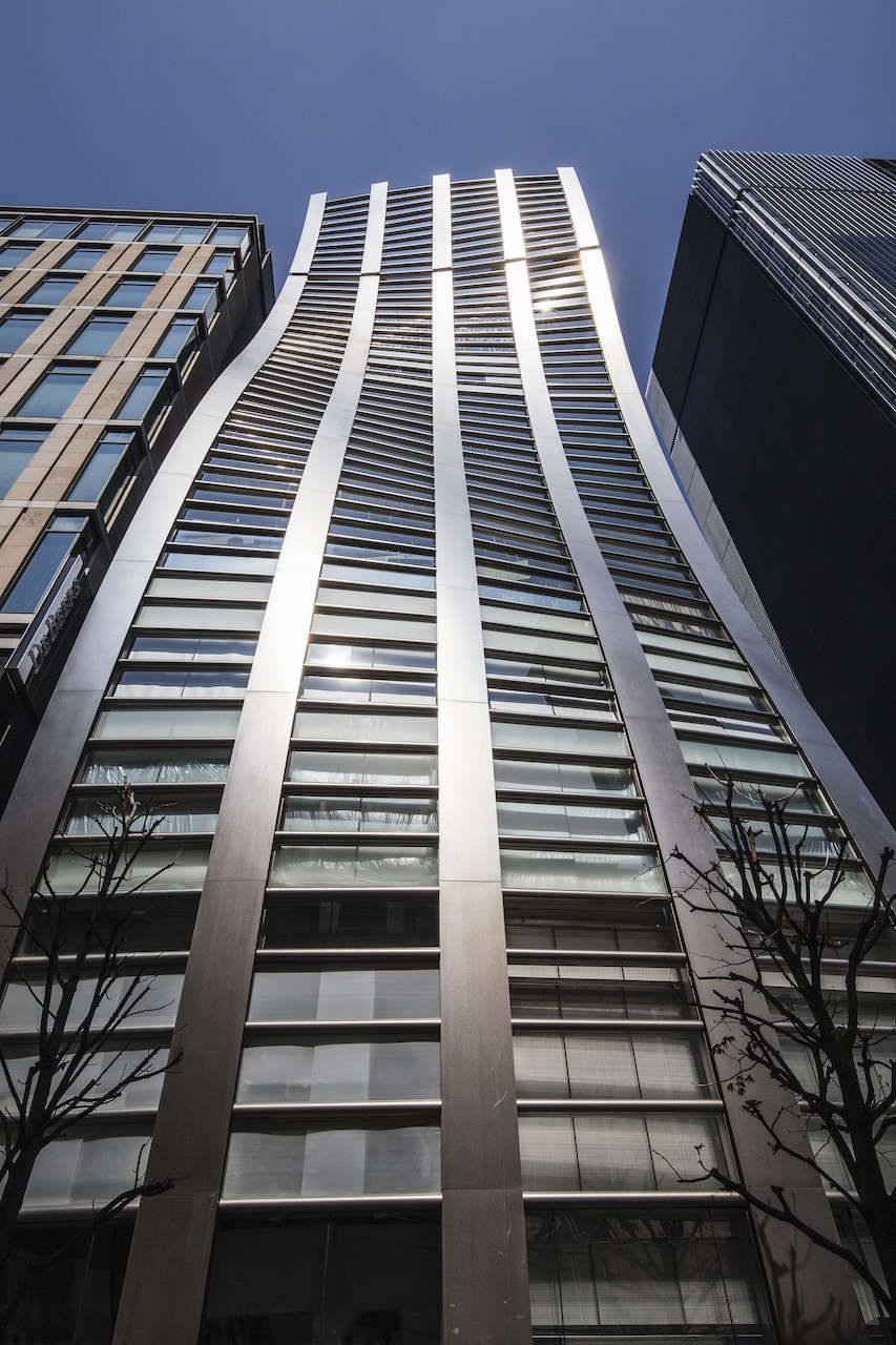 TOKYO, JAPAN - 2017/04/03: Ginza De Beers Building - Ginza is an upscale area of Tokyo with numerous department stores, boutiques, restaurants and is thus recognized as one of the most luxurious shopping districts in the world. Many upscale fashion flagship stores are located here, including Chanel, Dior, Gucci, Louis Vuitton.... In recent years extraordinary architecture has gone up including the De Beers Building, Mikimoto Pearls Building among others. Ginza is named after the silver-coin mint establish