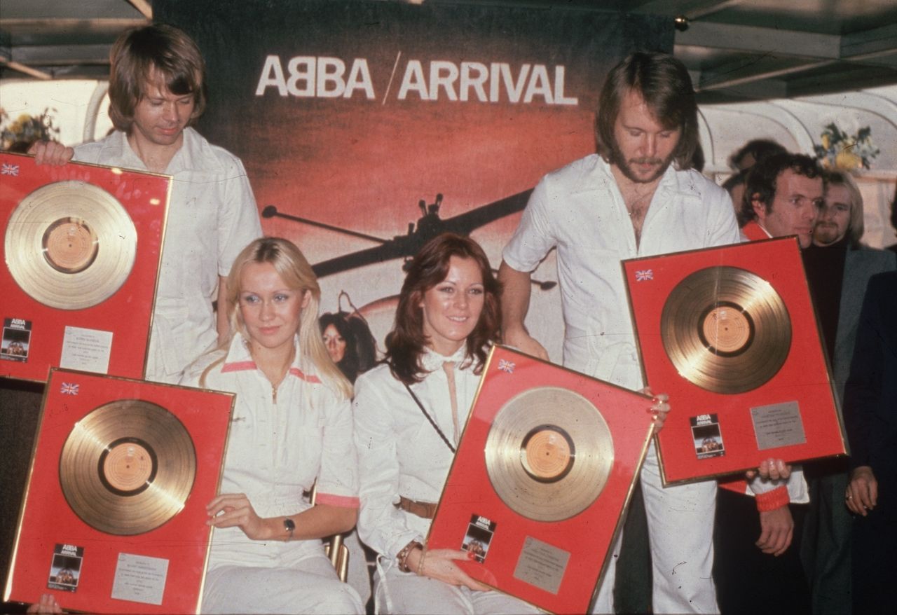 1976: Pop group Abba holding their golden discs. From l to r; Benny Andersson, Agnetha Faltskog, Anni-Frid Lyngstad and Bjorn Ulvaeus. A Swedish group except for Anni-Frid (Frida) who is Norwegian. (Photo by Hulton Archive/Getty Images)