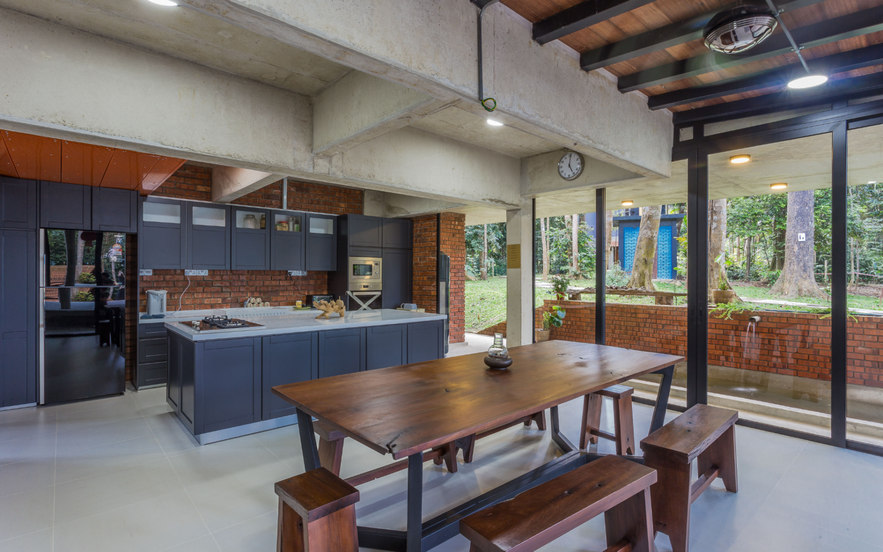 The kitchen has an expansive view of the outdoors, it's almost like dining al-fresco