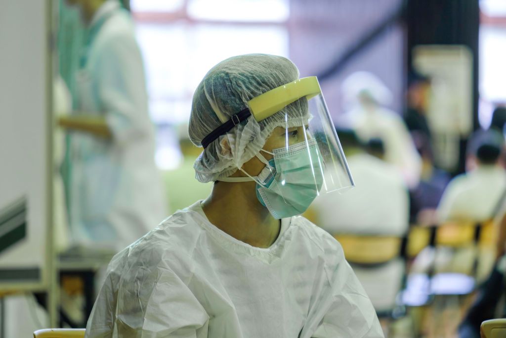 TAIPEI, TAIWAN - 2021/07/19: A medical worker wearing a personal protective equipment suit (PPE) is seen during the vaccination session in Taipei hospital ahead of the COVID-19 alert Level 3 restriction lift in Taipei. (Photo by Walid Berrazeg/SOPA Images/LightRocket via Getty Images)