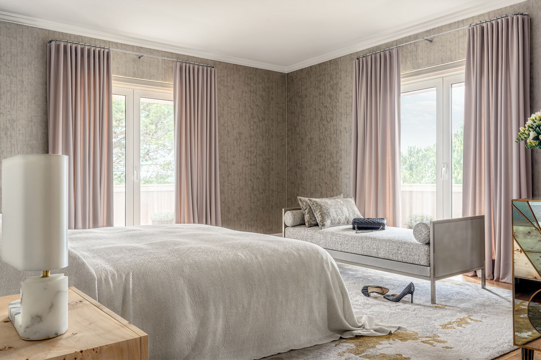 Caspia from Jim Thompson Fabrics lines the walls of the master bedroom, where the All Day bed from CJC Furniture Collection forms the focal point
