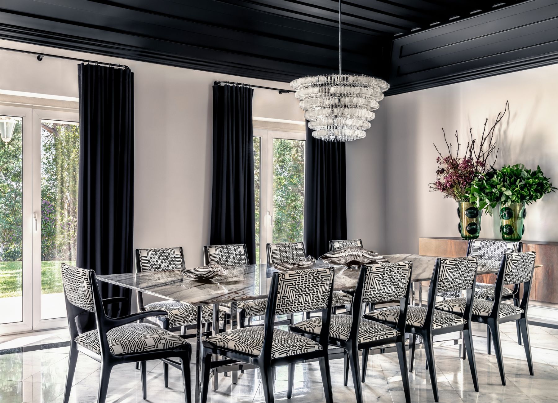 The dining room makes a strong statement with the statement-making ceiling in black