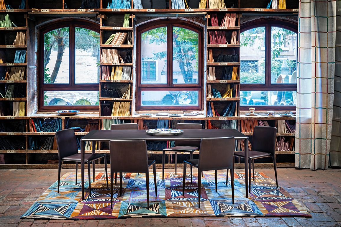 Solid wood  chairs and dinner table in anthracite shades, from the Constellation collection from MissoniHome's 2021 collection (Image: Courtesy of MissoniHome)