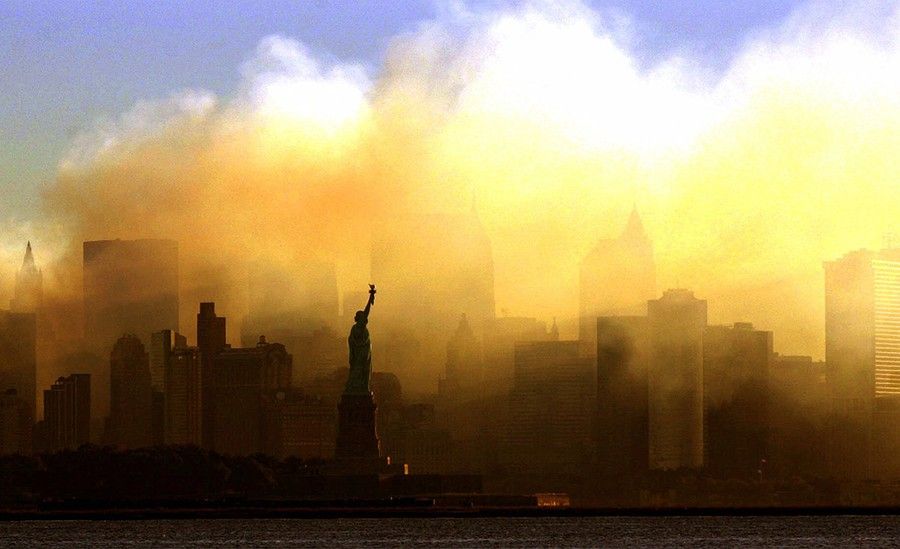 The Statue of Liberty, seen from a vantage point in Jersey City, New Jersey, as the lower Manhattan skyline is shrouded in smoke following the Sept. 11 terrorist attacks on the World Trade Center in New York. Photo taken on September 15, 2001. (Photo: AP Photo/Dan Loh)