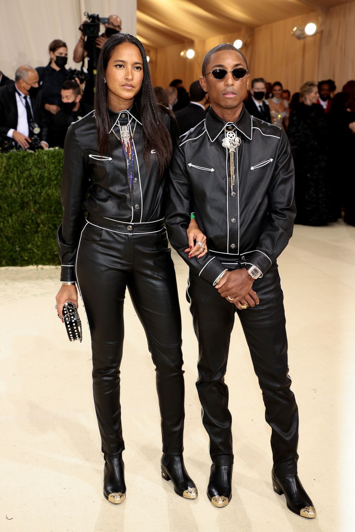 NEW YORK, NEW YORK - SEPTEMBER 13: Helen Lasichanh and Pharrell Williams attend The 2021 Met Gala Celebrating In America: A Lexicon Of Fashion at Metropolitan Museum of Art on September 13, 2021 in New York City. (Photo by Dimitrios Kambouris/Getty Images for The Met Museum/Vogue )