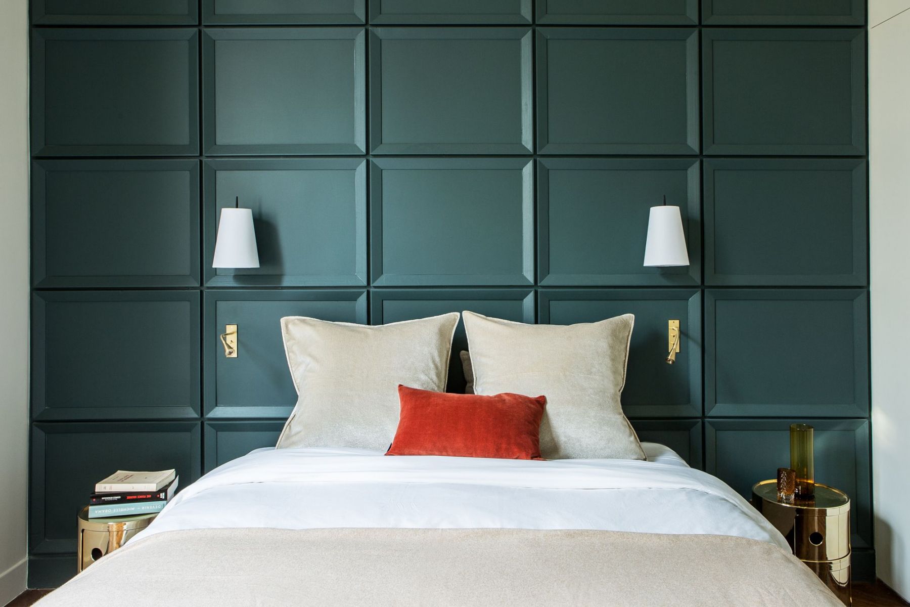 French interior architect and designer Dorothée Simon used a calming green hue to create a feature wall inspired by former hidden vaults in the master bedroom of a Paris apartment (Photo: Gilles Trillard)