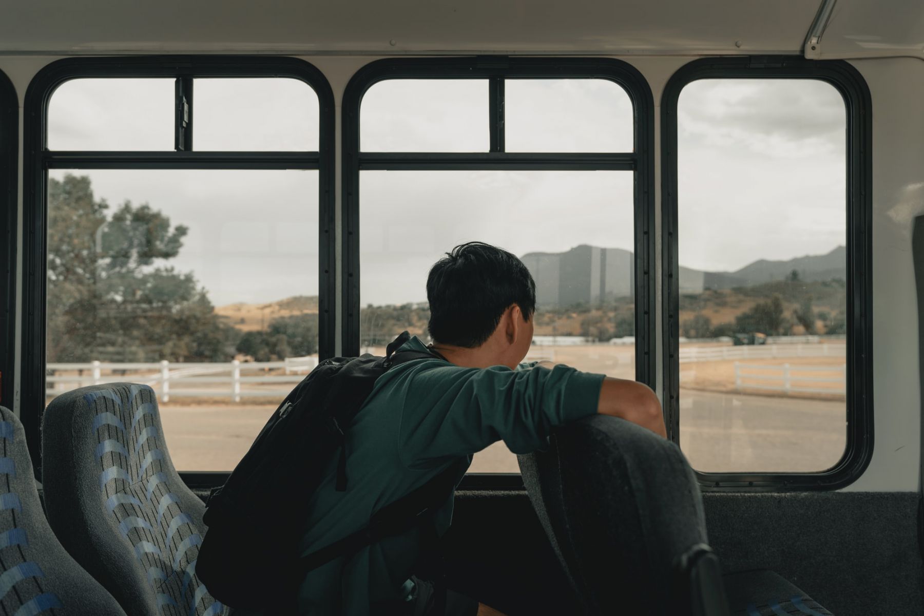 A commuter rides safely in a bus (Photo: Clay Banks/Unsplash)