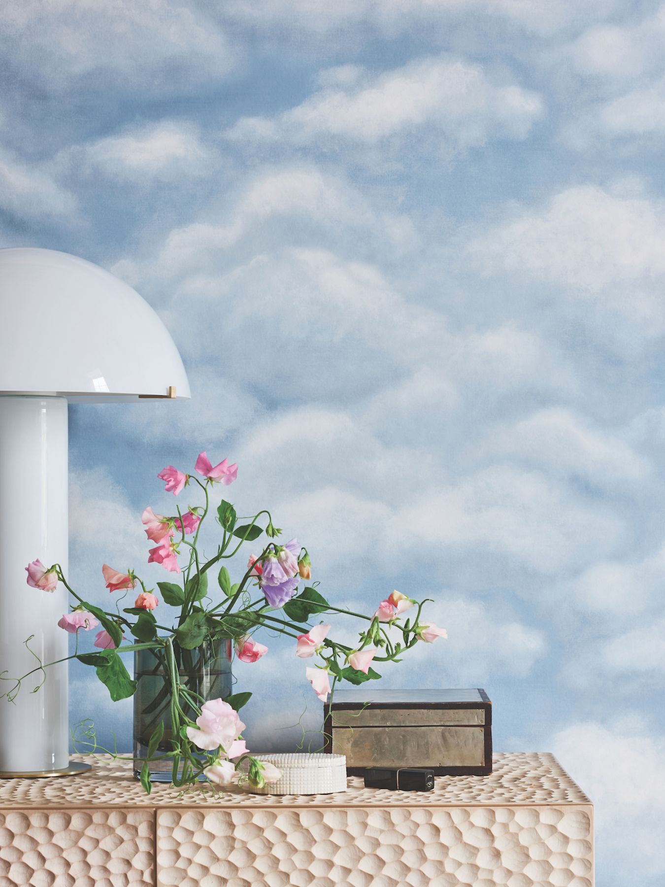 The ethereal wallpaper features whimsical clouds (Image: Courtesy of Cole & Son)