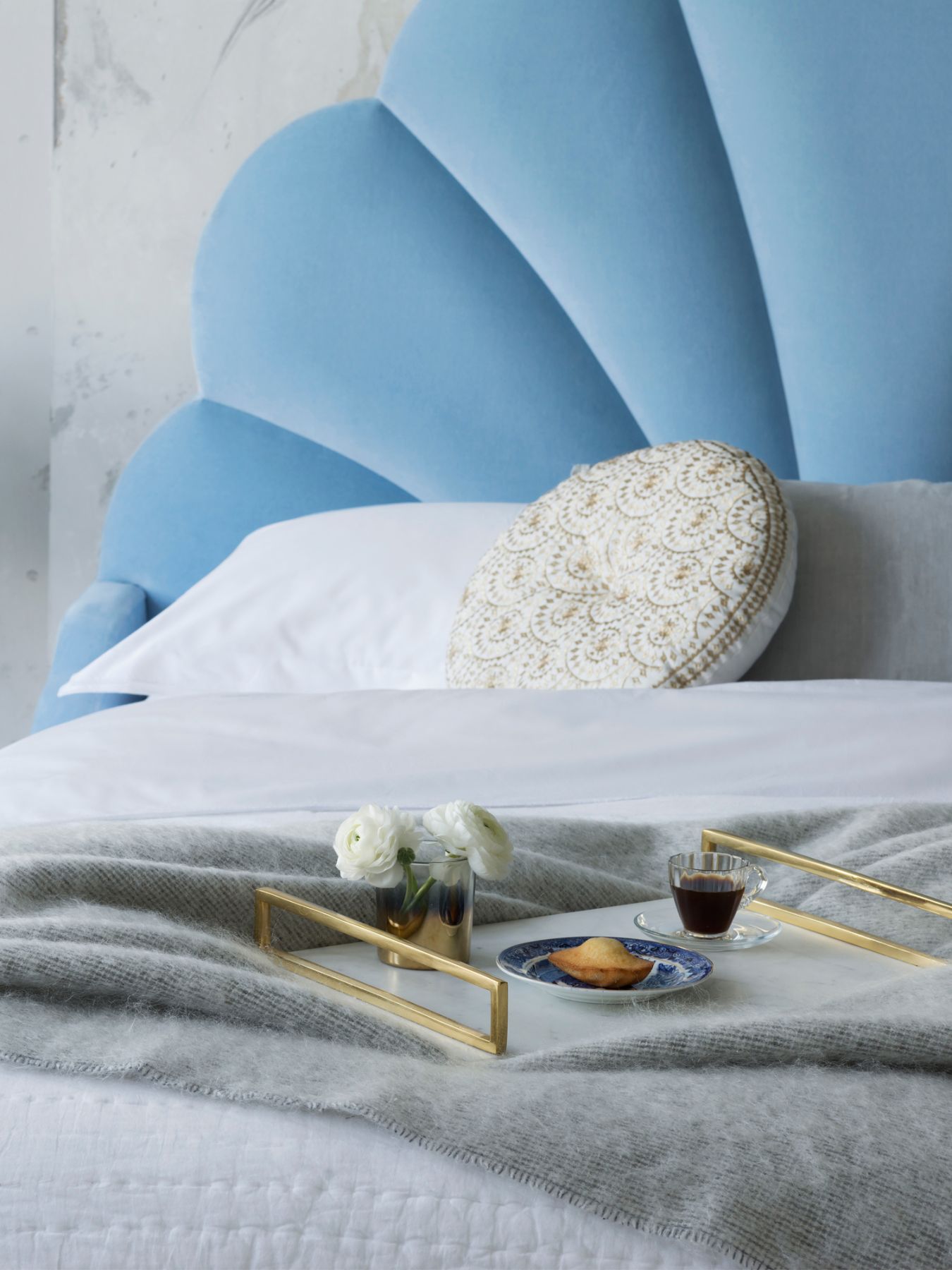 The chic headboard features a seashell-like design (Image: Courtesy of Sweetpea & Willow)