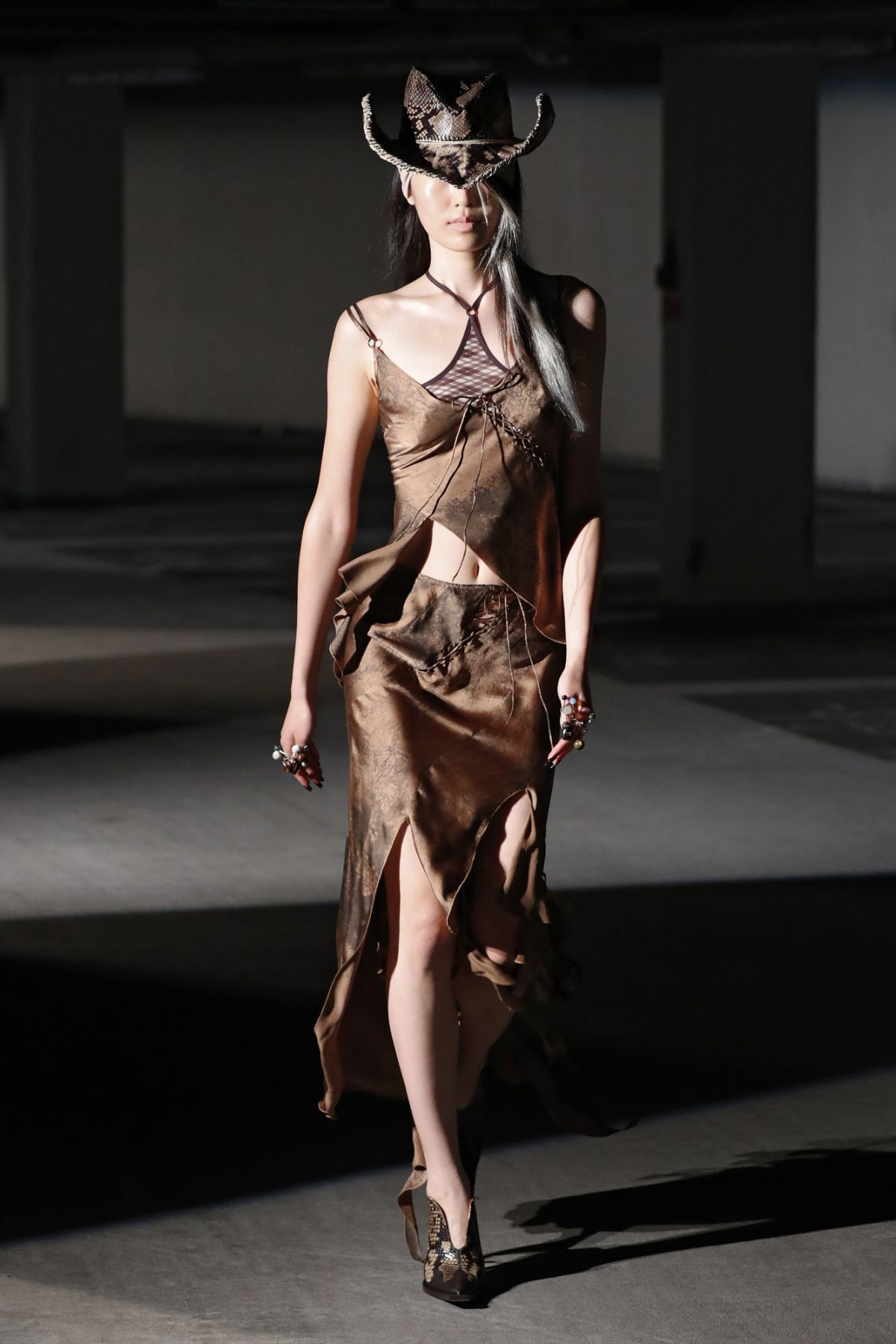 LONDON, ENGLAND - SEPTEMBER 18:A model walks the runway at the KNWLS show during London Fashion Week September 2021 at Q Park Level 3 on September 18, 2021 in London, England.(Photo by Estrop/Wireimage)