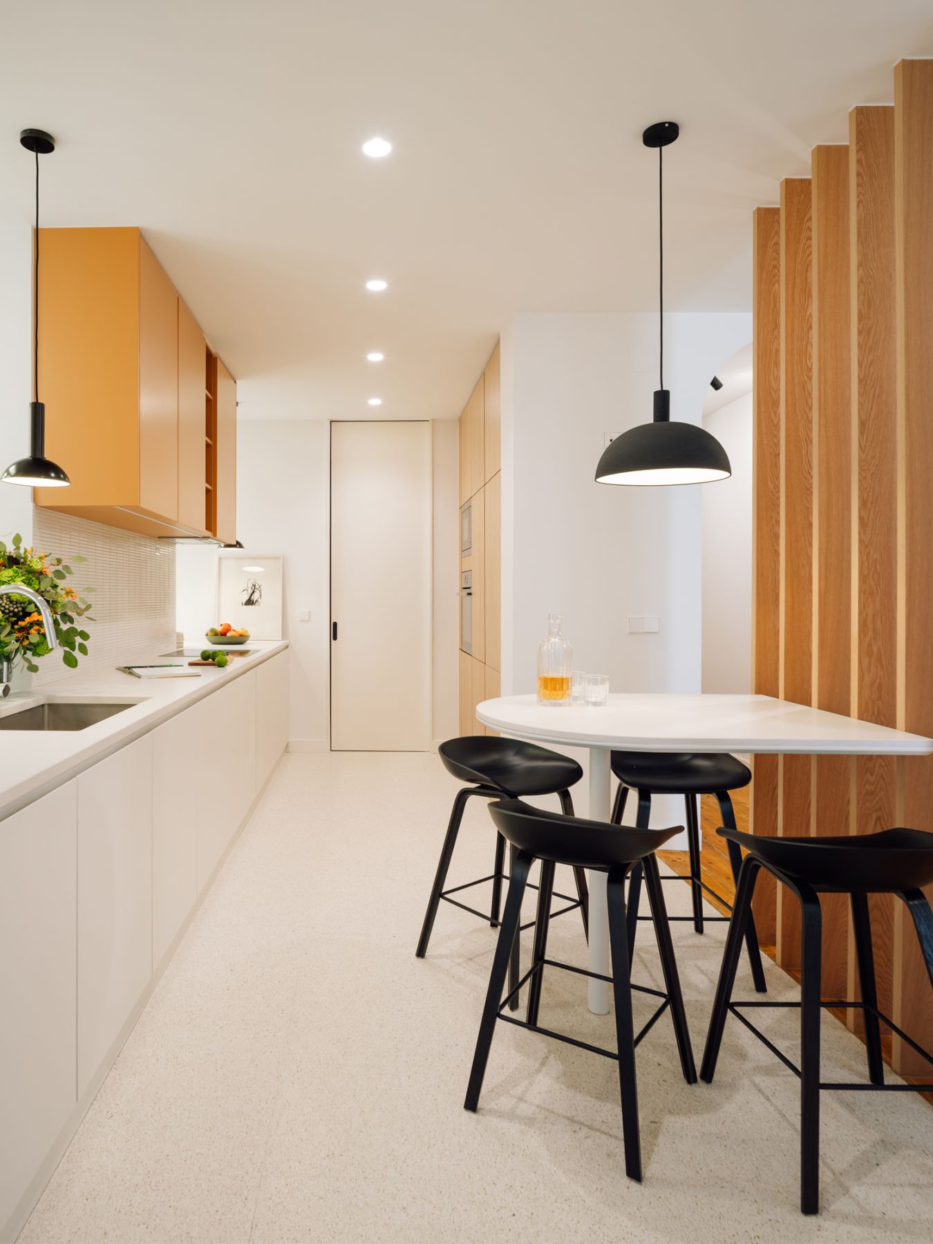 The vibrant kitchen features a casual breakfast nook for quick meals