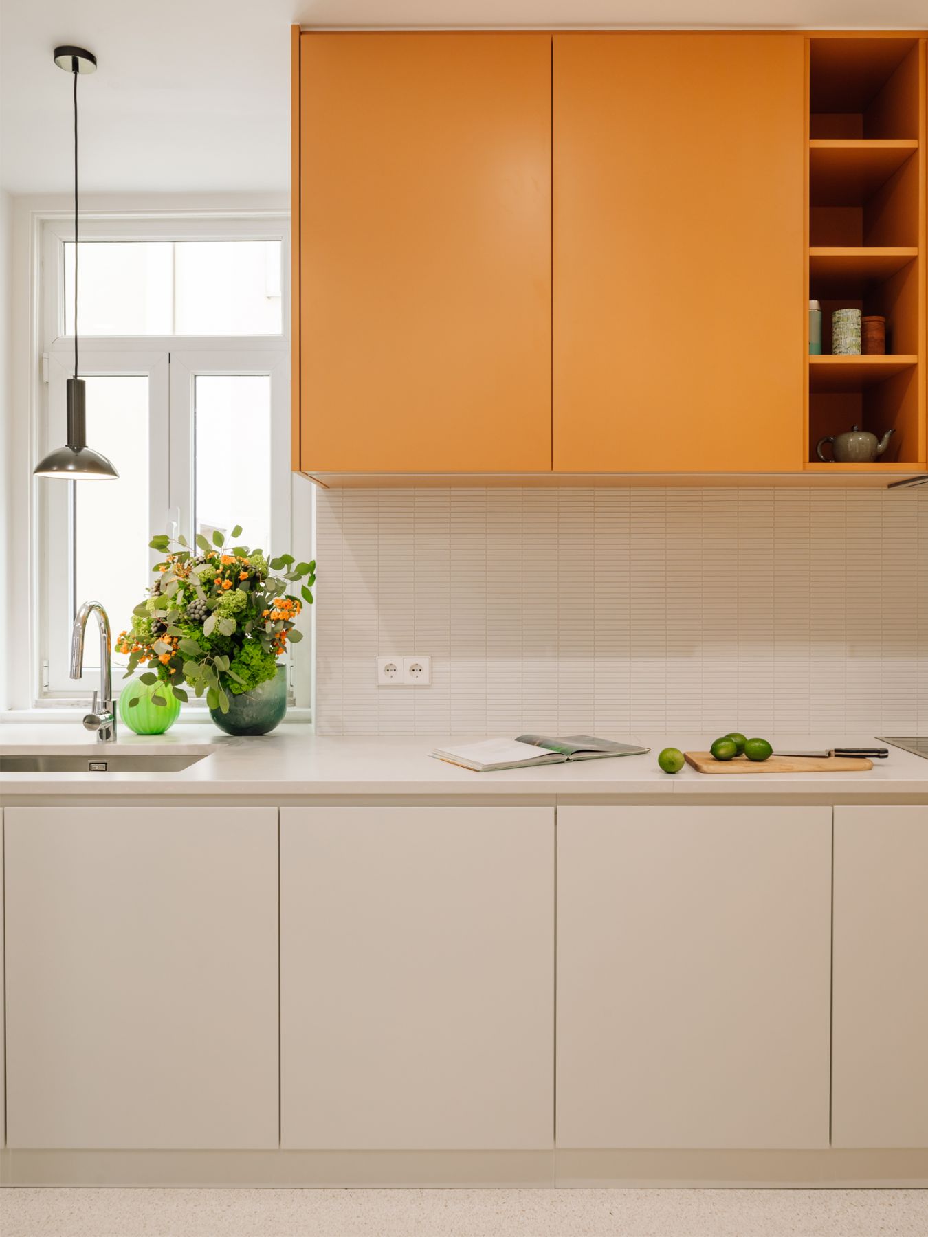 The kitchen is crafted from a deft combination of materials that are carefully selected to blend homogeneously together with the other design elements