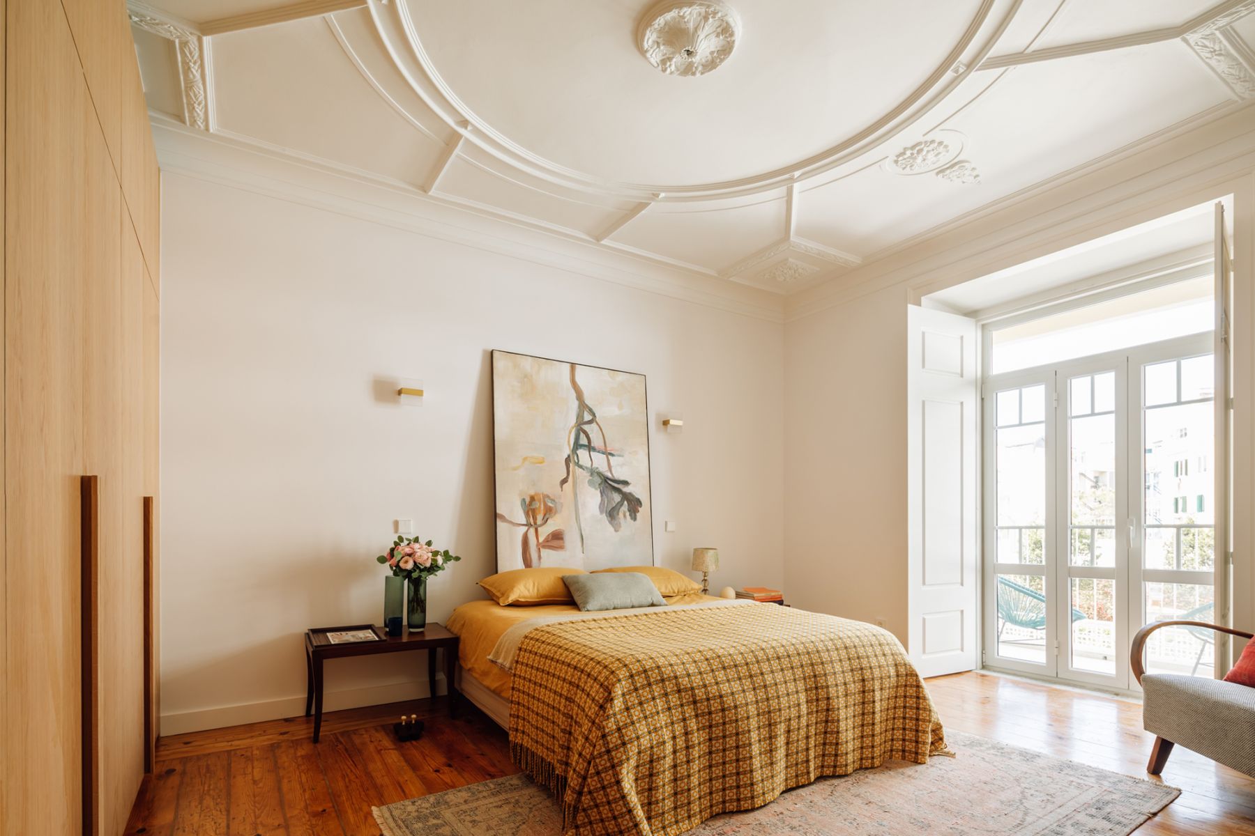 The decorative ceilings, a statement feature left untouched by the design team, is also evident in the master bedroom