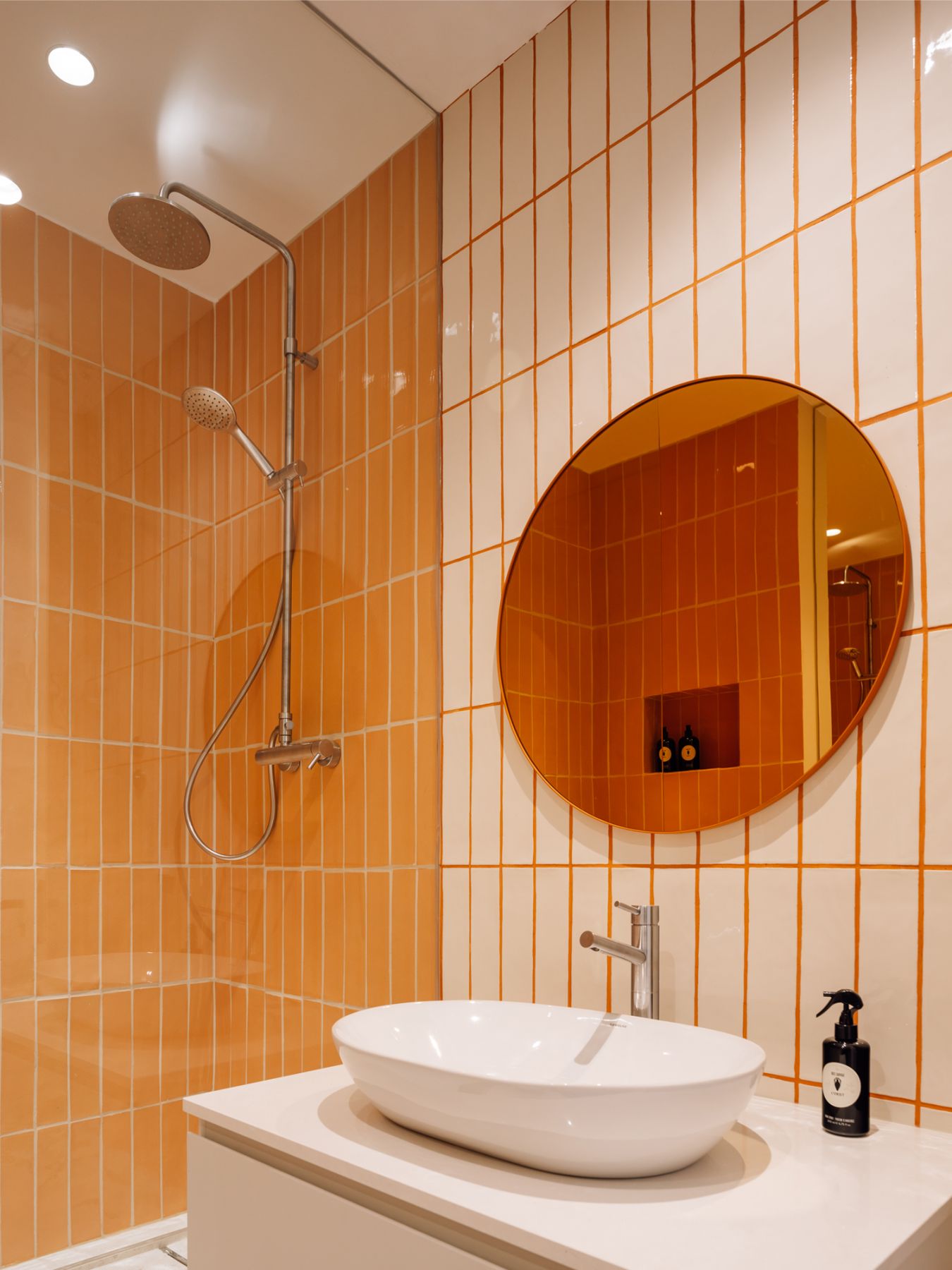 The colourful bathroom tiles add a zesty vibrance to the overall look of the home