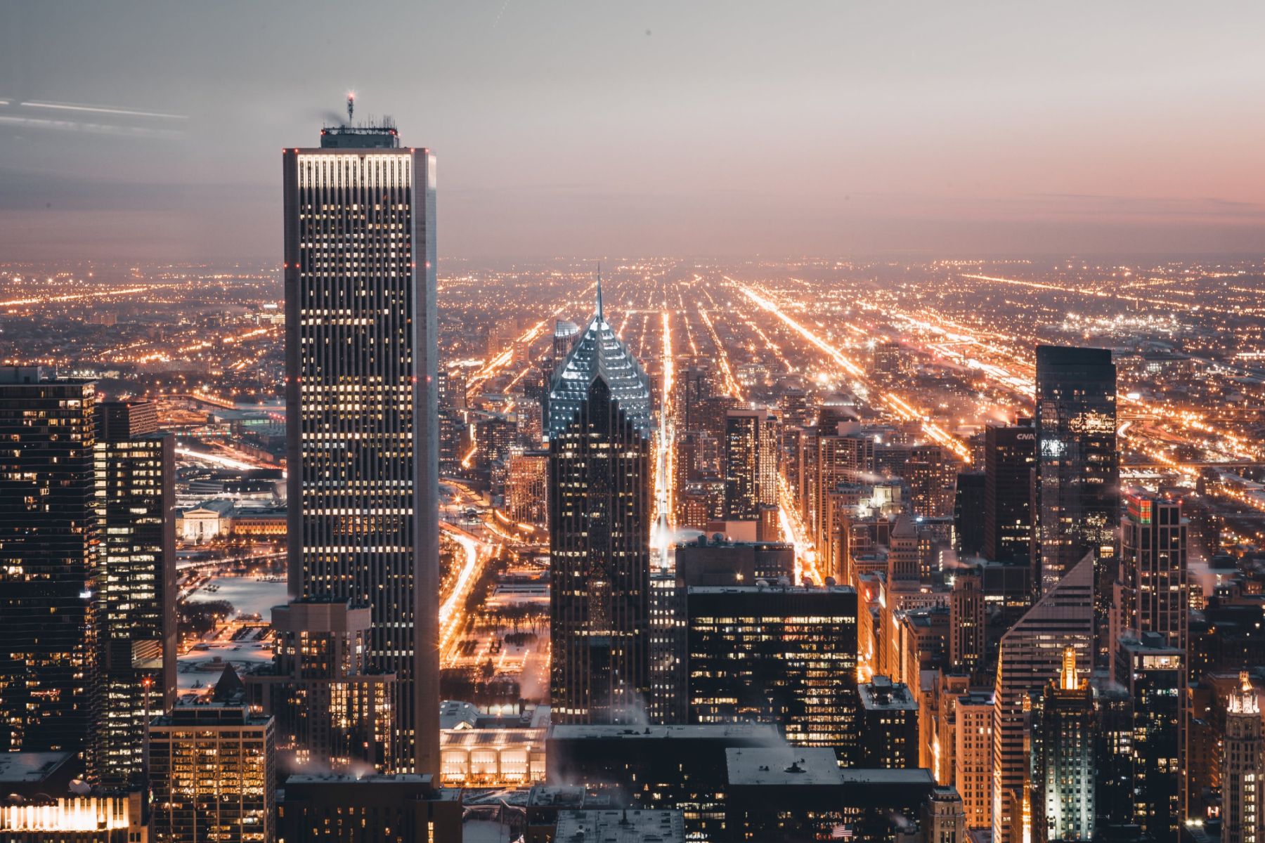 High-rise buildings at night (Photo: Burst/Pexels)