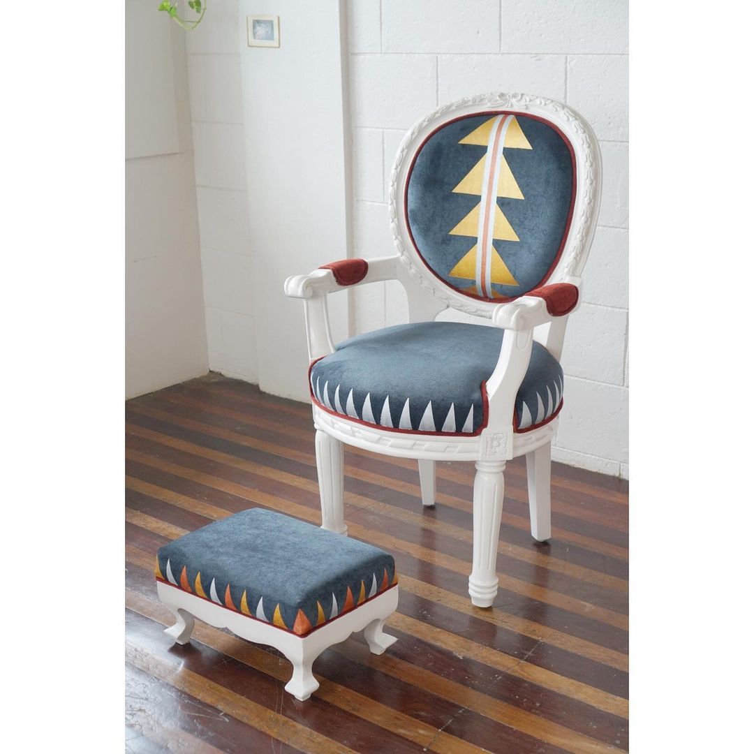 A newly restored and upholstered Louis chair with footstool