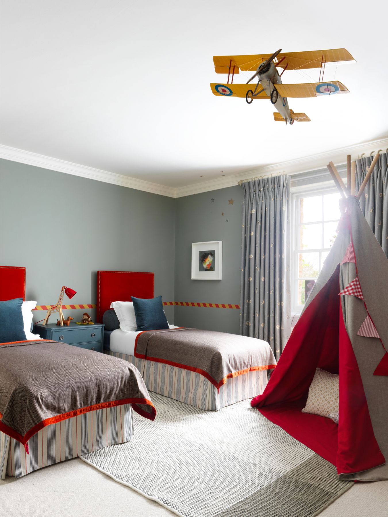 Farrow & Ball's Pigeon form the grey base colour to the boy's bedroom that's designed to spark inspiration and adventure