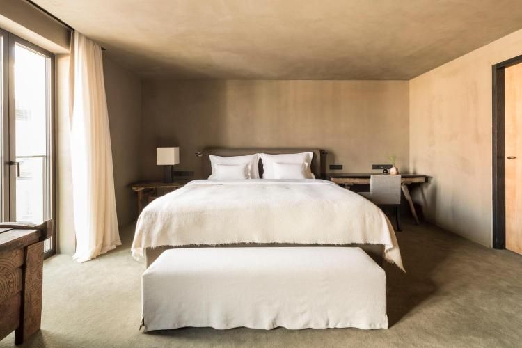 Designed by Axel Vervoordt in 2019, this refreshed bedroom in Hotel Bayerischer Hof exudes an aura of calm (Image: Courtesy of Hotel Bayerischer Hof)