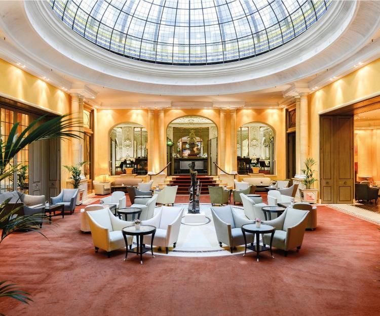 A stunning domed stained glass ceiling greets guests in the lobby of Hotel Bayerischer Hof (Image: Courtesy of Hotel Bayerischer Hof)