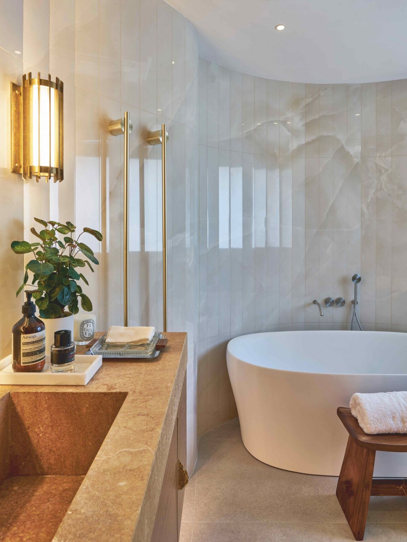 Curved corners and wooden details add a timeless elegance to the space (Photo: Xu Liang Leon)