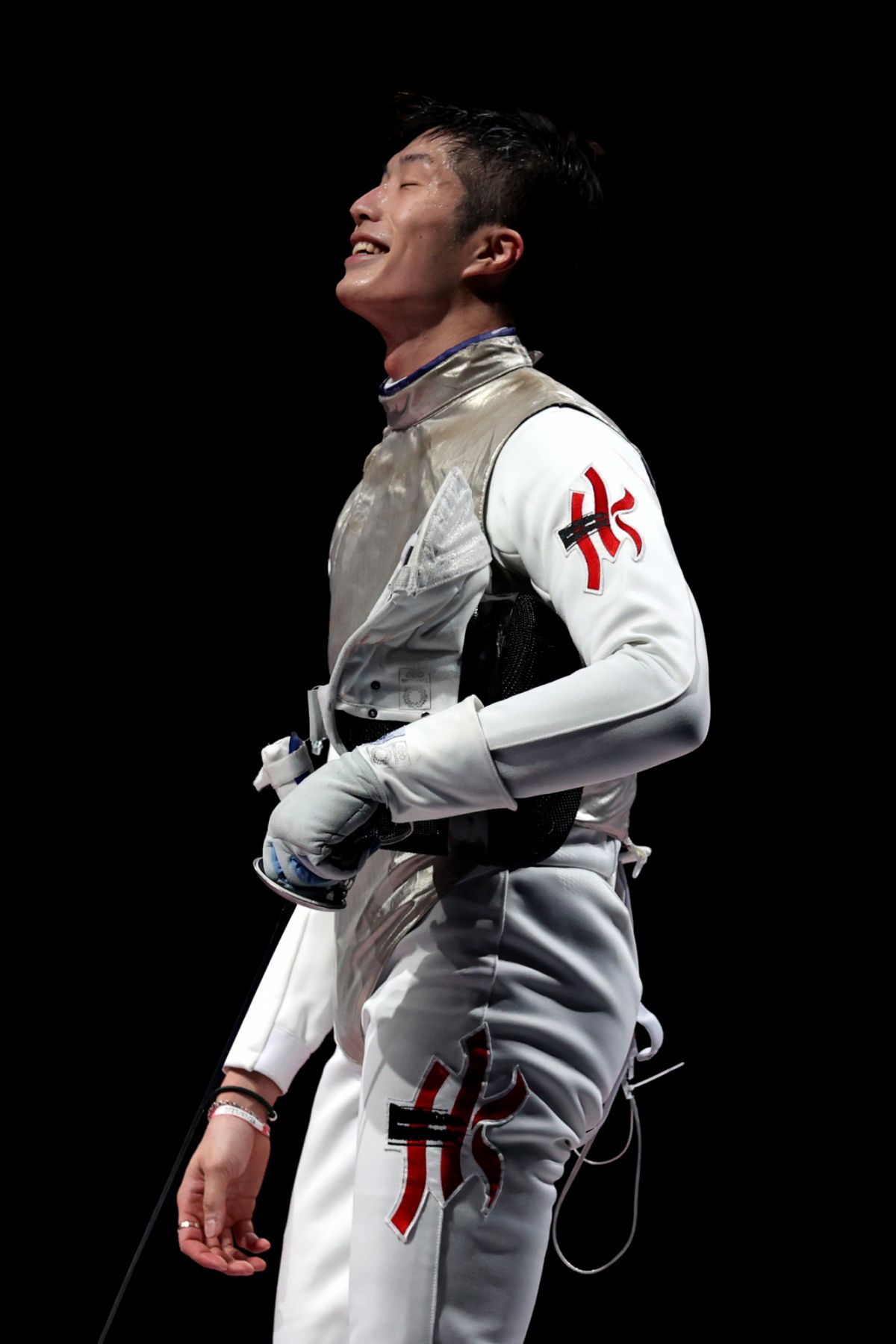 CHIBA, JAPAN - JULY 26: Ka Long Cheung of Team Hong Kong celebrates after winning the Men's Foil Individual Fencing semifinal 2 against Alexander Choupenitch of Team Czech Republic on day three of the Tokyo 2020 Olympic Games at Makuhari Messe on July 26, 2021 in Chiba, Japan. (Photo by Elsa/Getty Images)