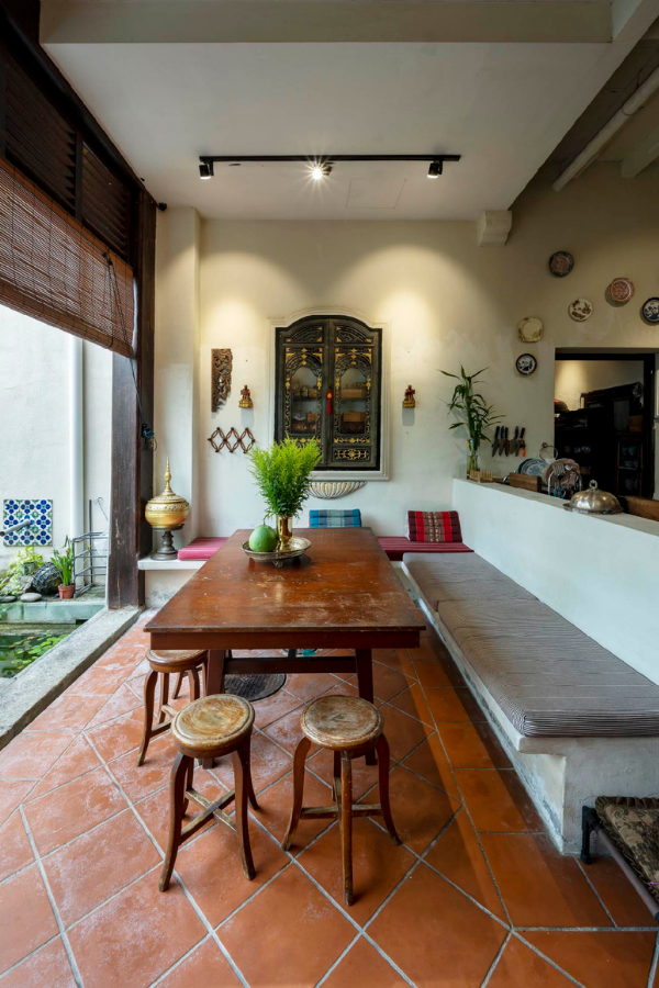 A dining nook facing the garden and water feature.