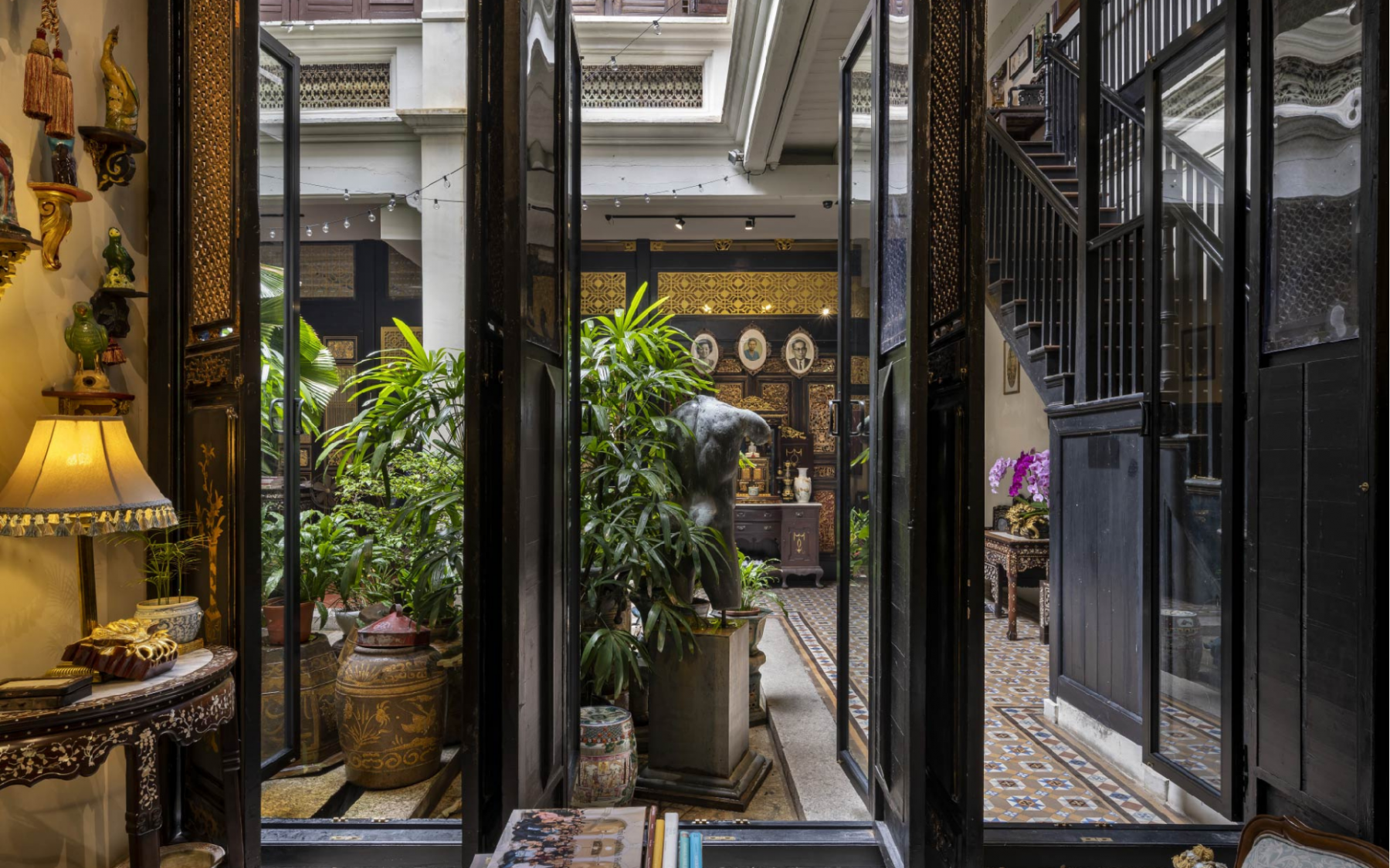 Antique Intricately carved doors open up to the internal courtyard.