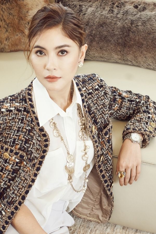 Sarah Shahdan wears her own Calvin Klein blouse, Chanel jacket and Giorgio Armani jewellery