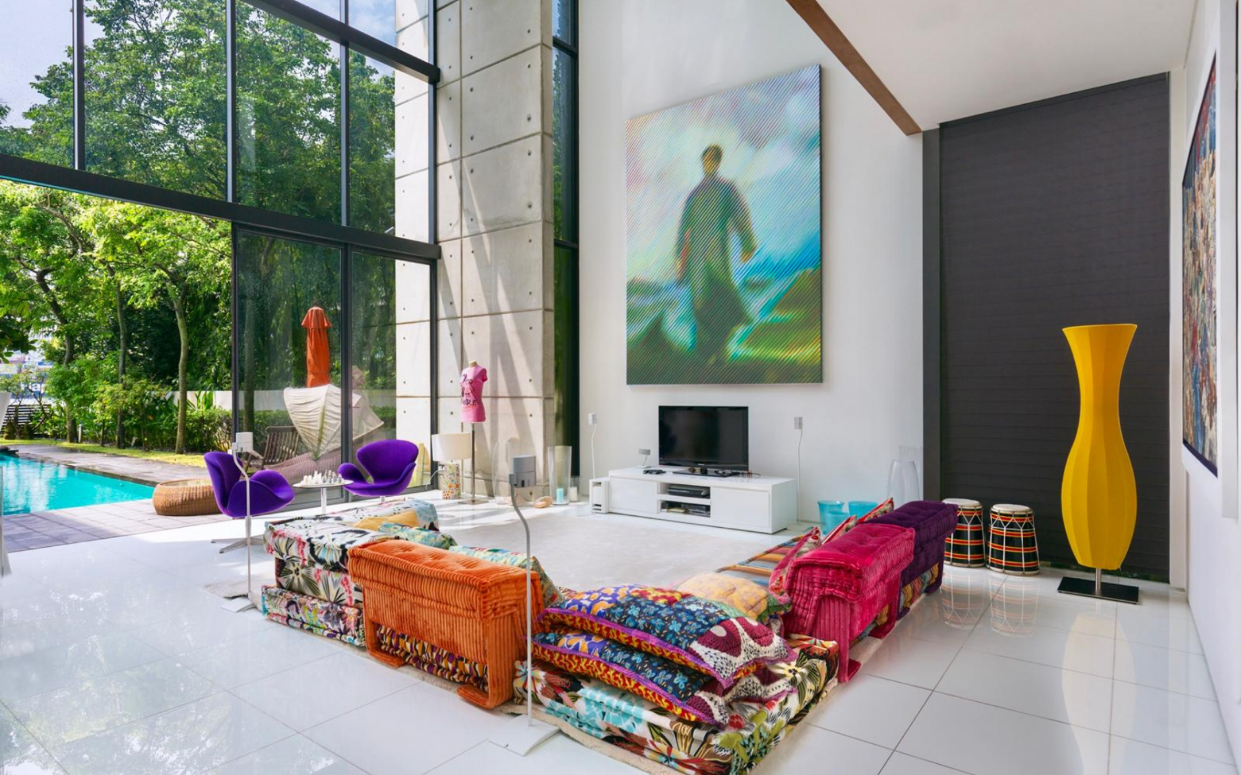 The living room has large format windors and doors