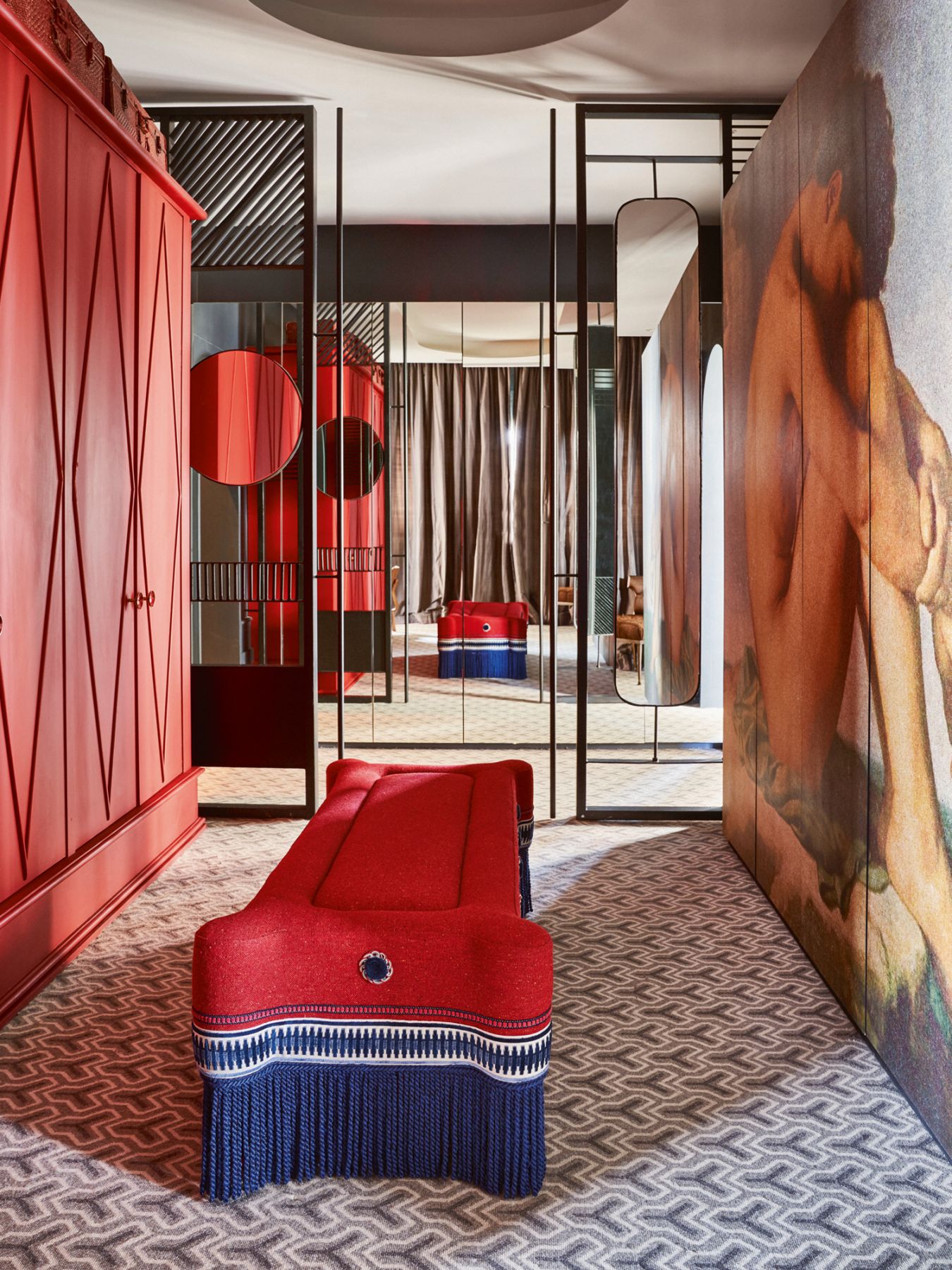 The dressing room features cabinetry clad with a print of Jean-Hippolyte Flandrin’s iconic Young Man by the Seapainting, and a custom bench in a Casamance fabric and Gancedo trimmings