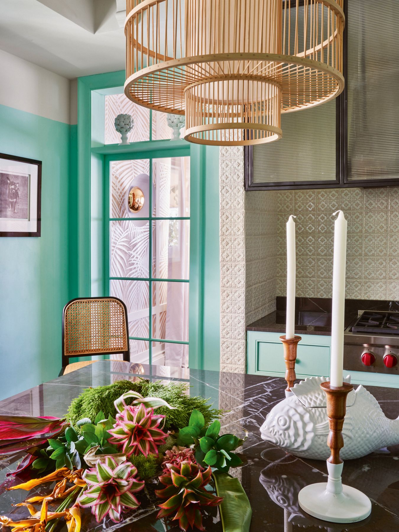A mix of wood, marble and ceramics lends visual weight to the kitchen