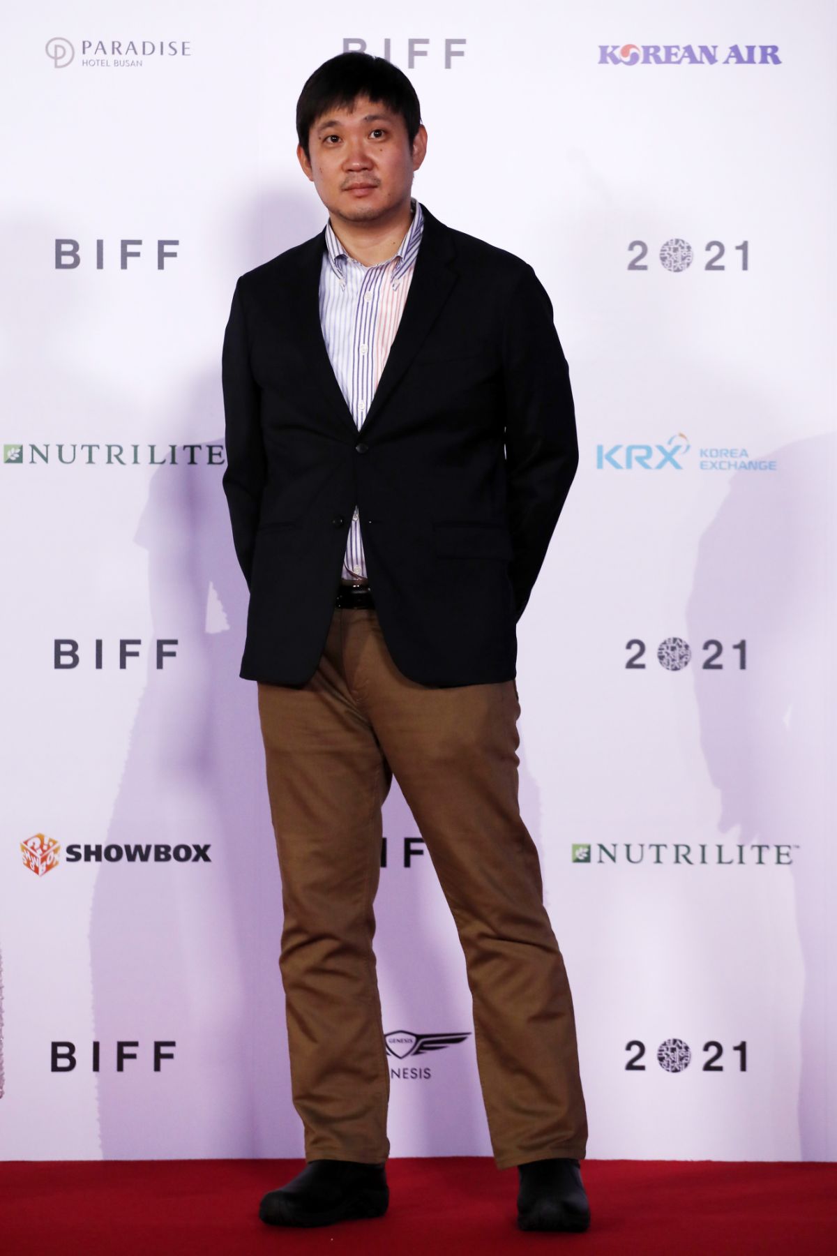 BUSAN, SOUTH KOREA - OCTOBER 06: Ryusuke Hamaguchi arrives at the opening ceremony of the 26th Busan International Film Festival at the Busan Cinema Center on October 06, 2021 in Busan, South Korea. (Photo by Woohae Cho/Getty Images)