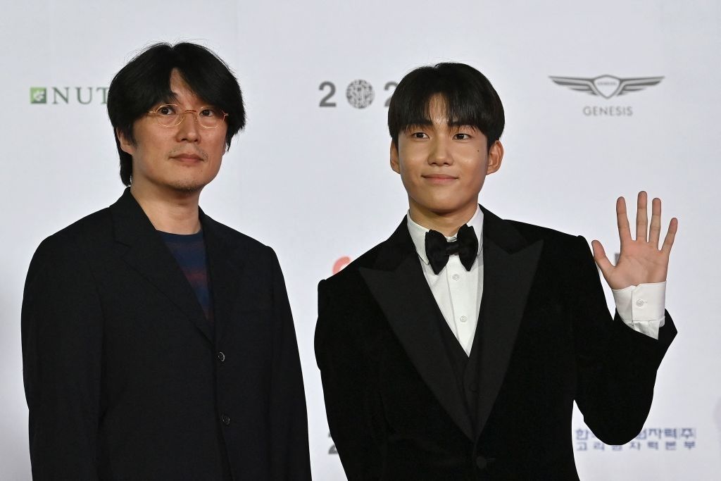 South Korean director Kim Sung-ho (L) and South Korean-Malaysian actor Tang Joon-sang (R) pose on the red carpet during the opening ceremony of the 26th Busan International Film Festival (BIFF) at the Busan Cinema Center in Busan on October 6, 2021. (Photo by Jung Yeon-je / AFP) (Photo by JUNG YEON-JE/AFP via Getty Images)